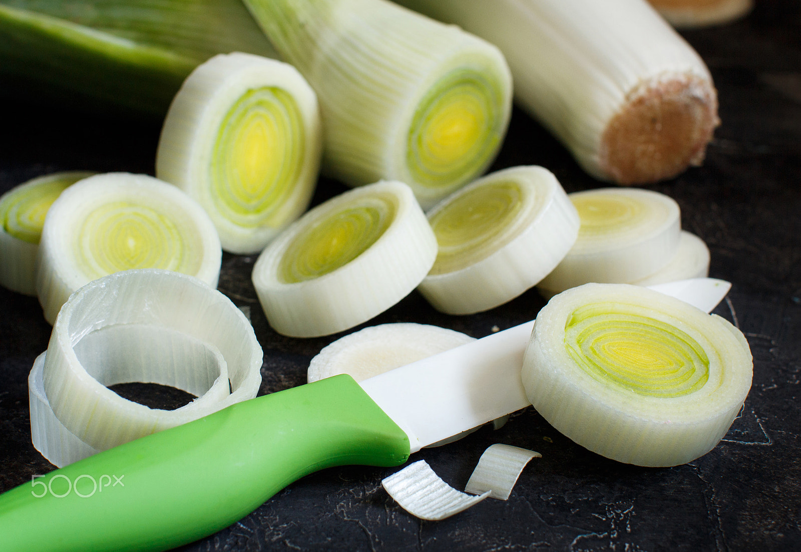 Canon EOS 650D (EOS Rebel T4i / EOS Kiss X6i) + Canon EF 50mm F1.2L USM sample photo. Fresh leeks whole and sliced photography
