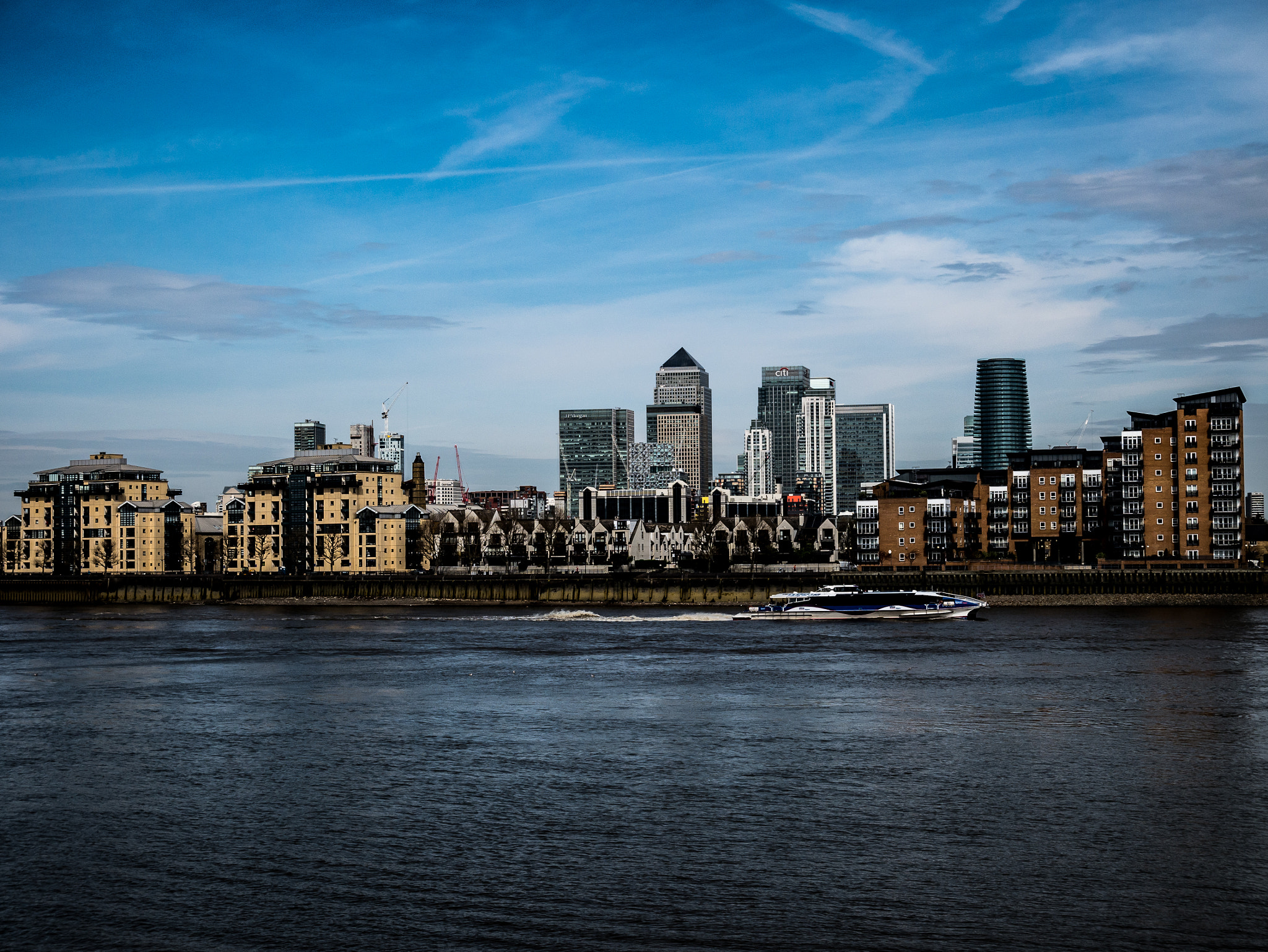 Panasonic Lumix DMC-GF7 + Panasonic Lumix G Vario HD 12-32mm F3.5-5.6 Mega OIS sample photo. Canary wharf across the water photography