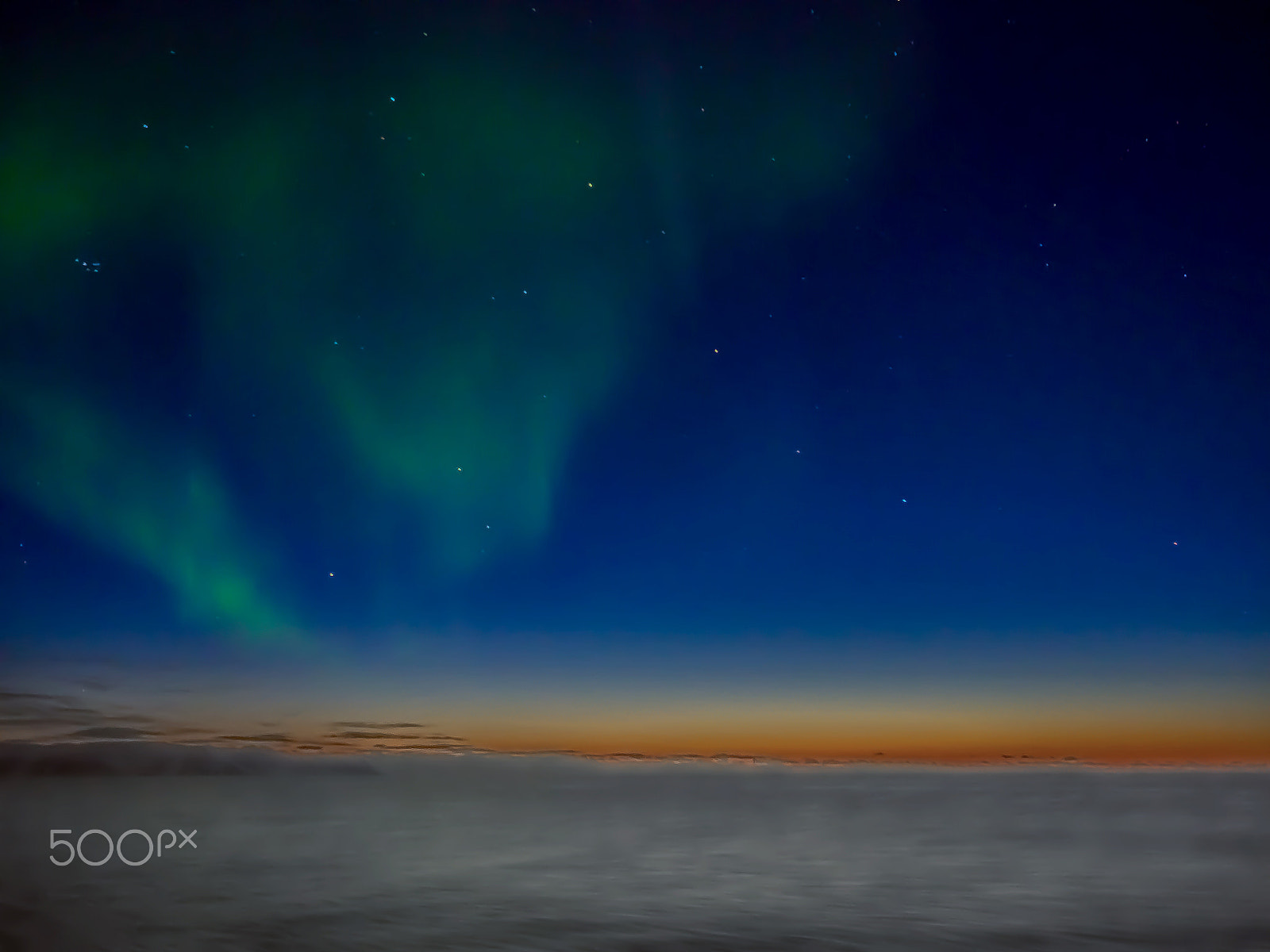 Olympus OM-D E-M5 II + Olympus M.Zuiko Digital ED 12-40mm F2.8 Pro sample photo. Northern lights above the cloud at sunset photography