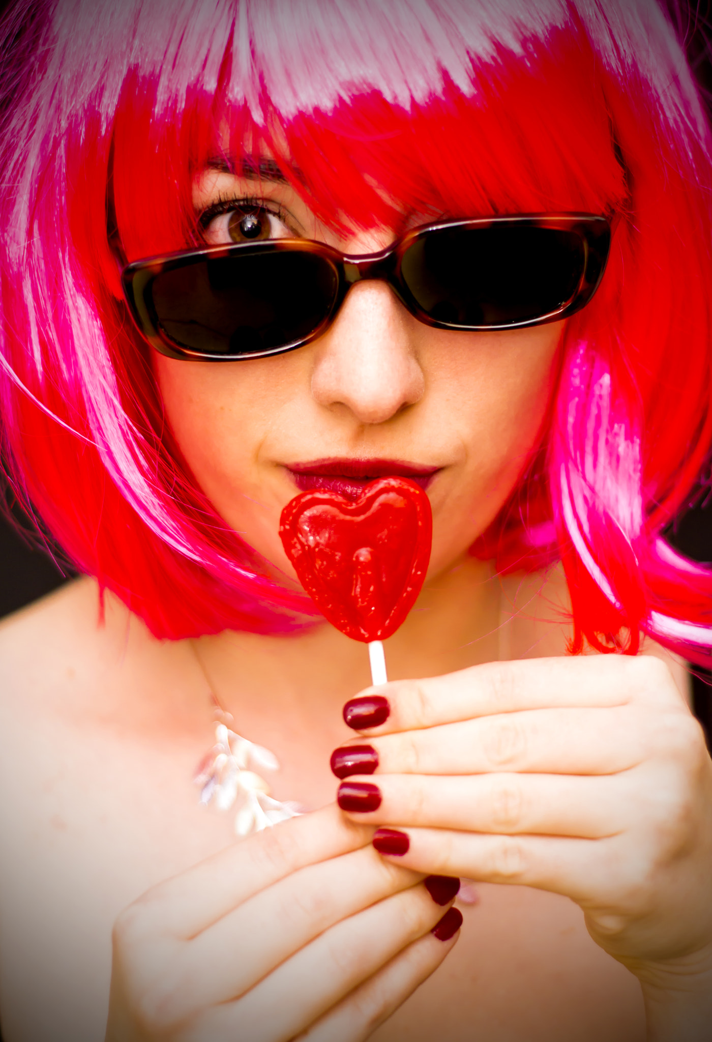 Nikon D7100 + Nikon AF Nikkor 50mm F1.8D sample photo. Pretty girl eating a heart-shaped candy photography