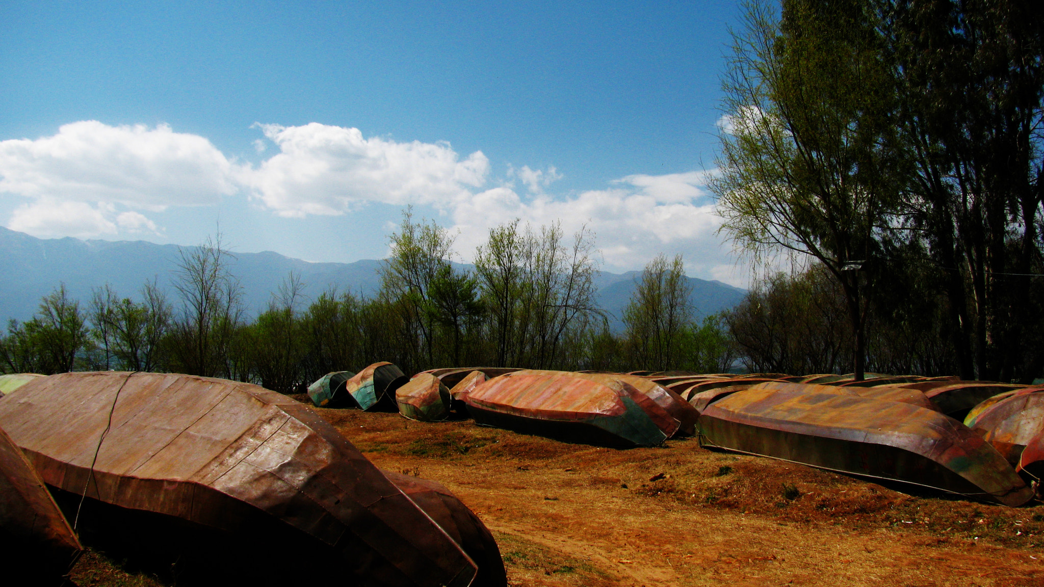 Canon PowerShot SX110 IS sample photo. Boats by lake photography