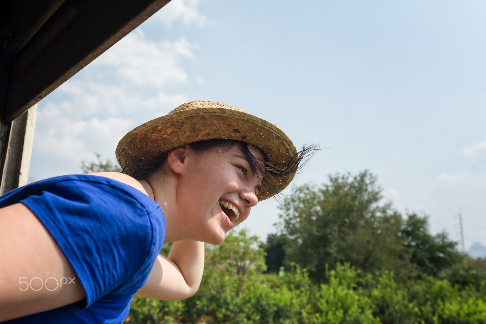 Nikon D7100 sample photo. Happy tourist girl enjoying the ride in a train photography