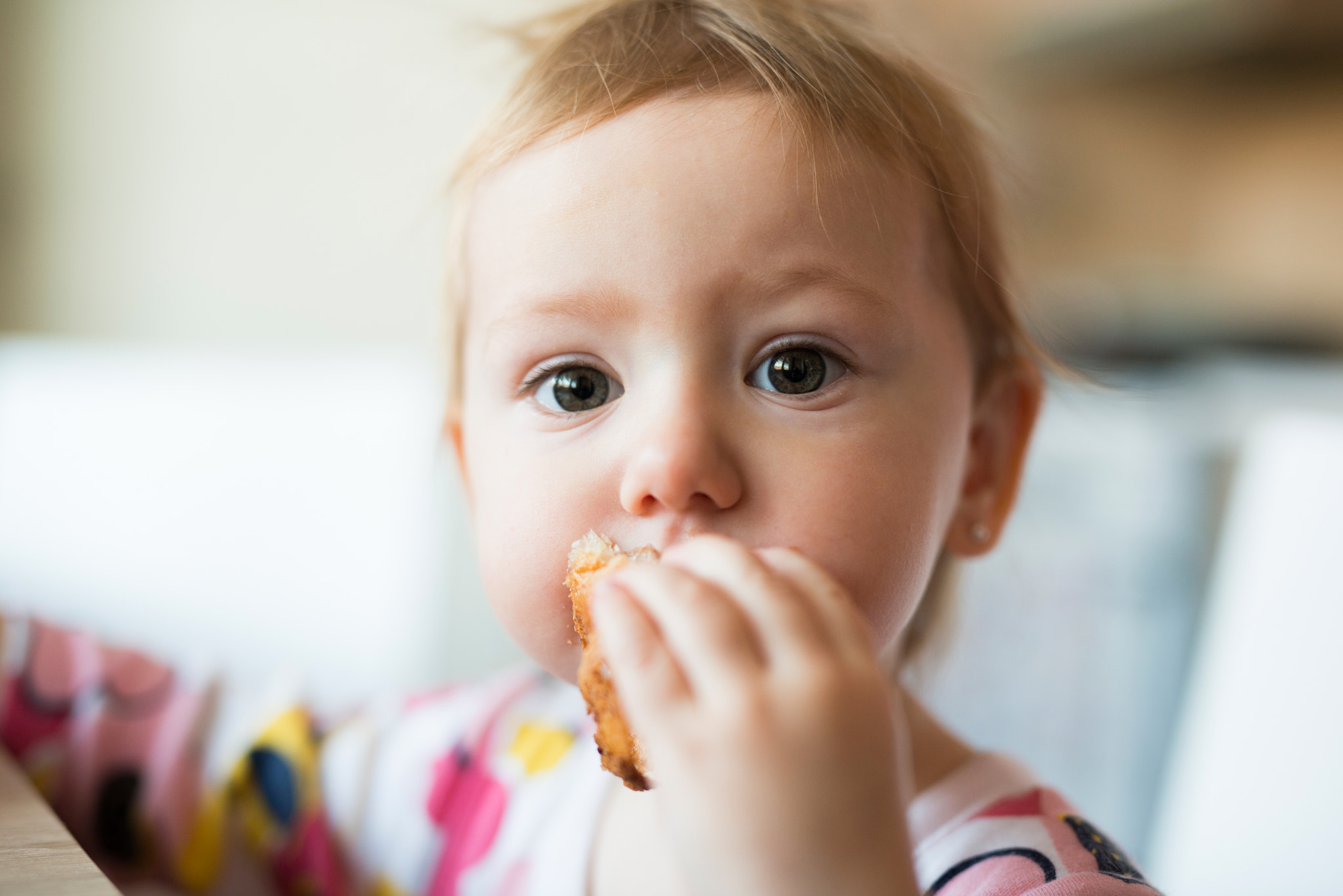 Nikon D800 + Sigma 50mm F1.4 DG HSM Art sample photo. Cute little girl sitting at the table eating croissant photography