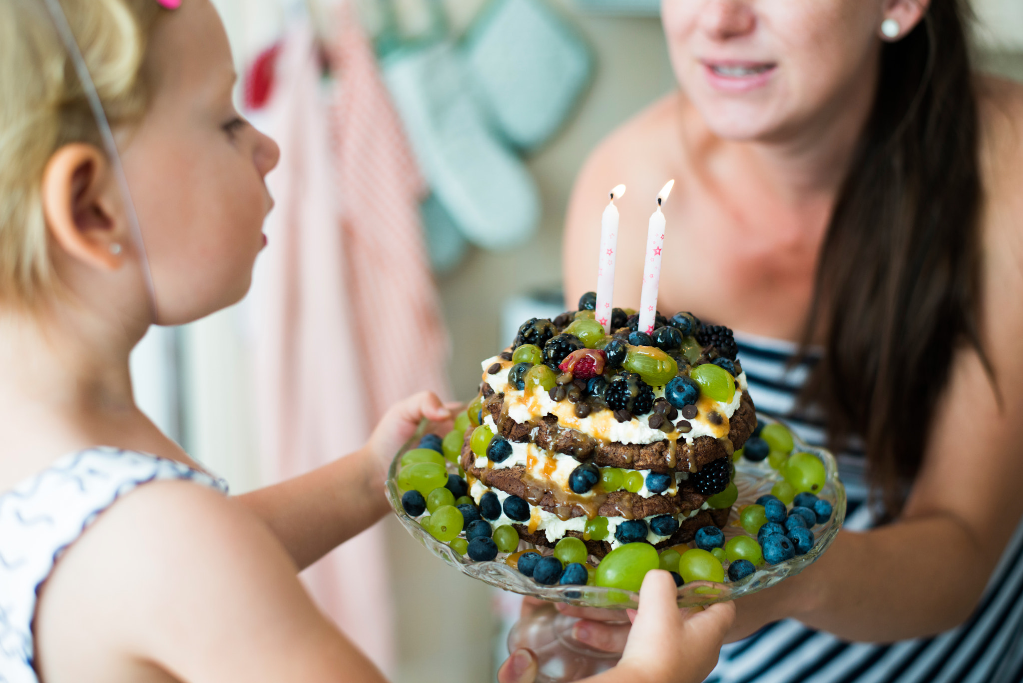 Nikon D800 + Nikon AF-S Nikkor 50mm F1.8G sample photo. Mother giving her cute daughter birthday cake with candles photography