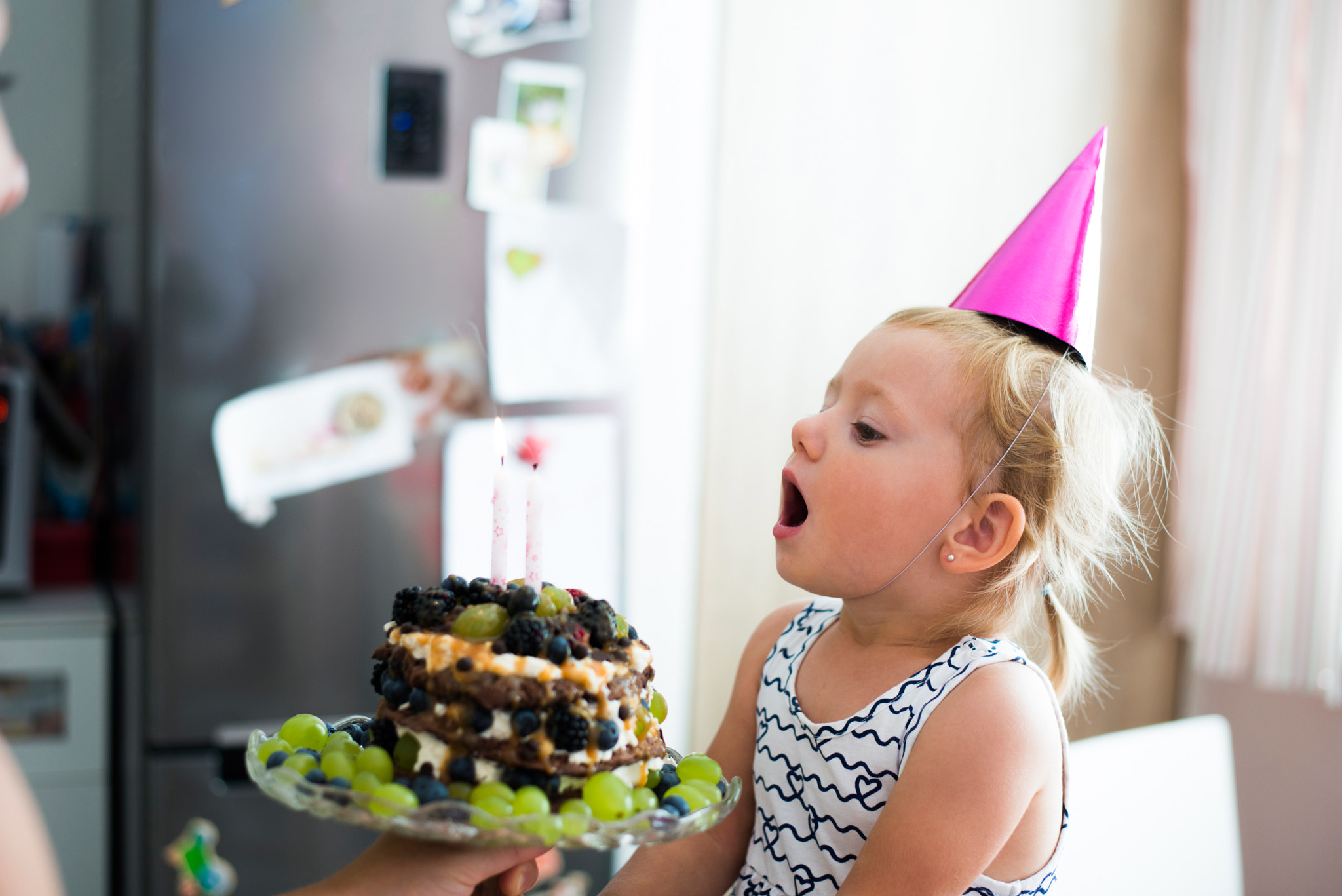 Nikon D800 + Nikon AF-S Nikkor 50mm F1.8G sample photo. Cute little girl blowing candles on her birthday cake photography