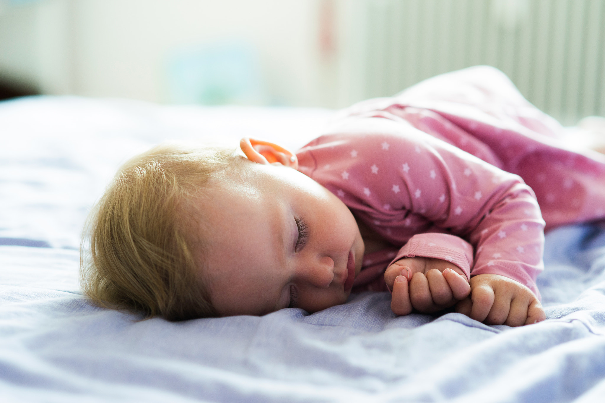 Nikon D4S sample photo. Cute little baby girl at home lying on bed, sleeping photography