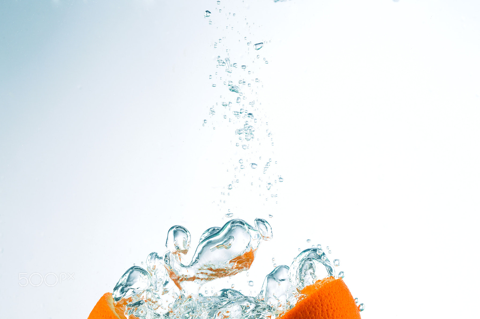 Canon EOS-1D Mark IV + Canon EF 100mm F2.8L Macro IS USM sample photo. Orange in streams of water on a white background photography