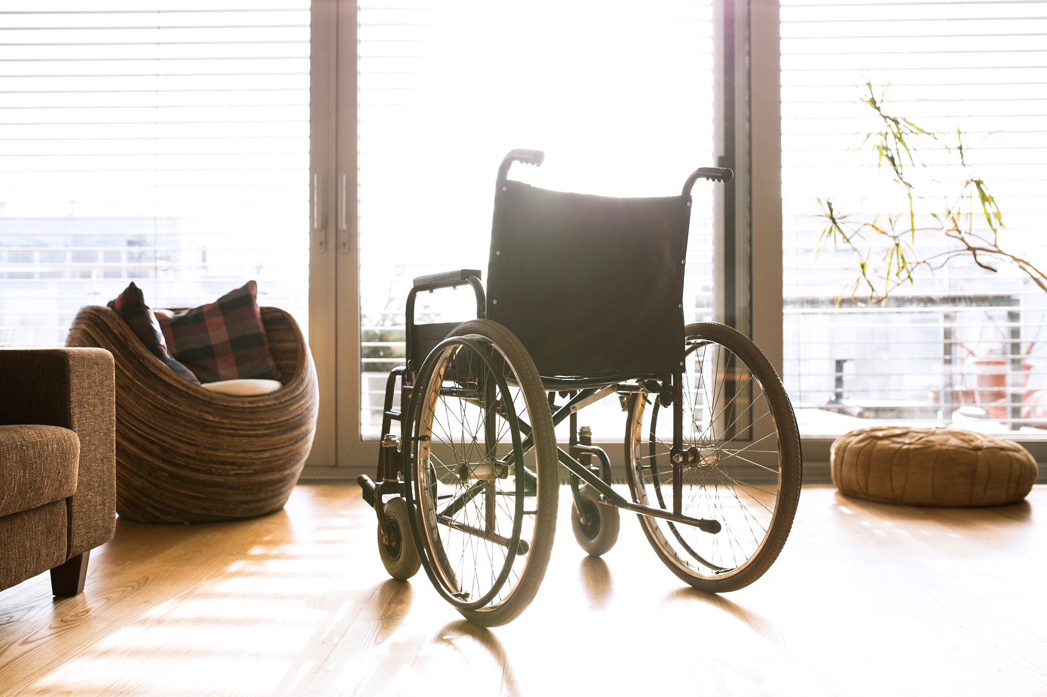 Nikon D4S sample photo. Empty wheelchair in living room next to the couch photography