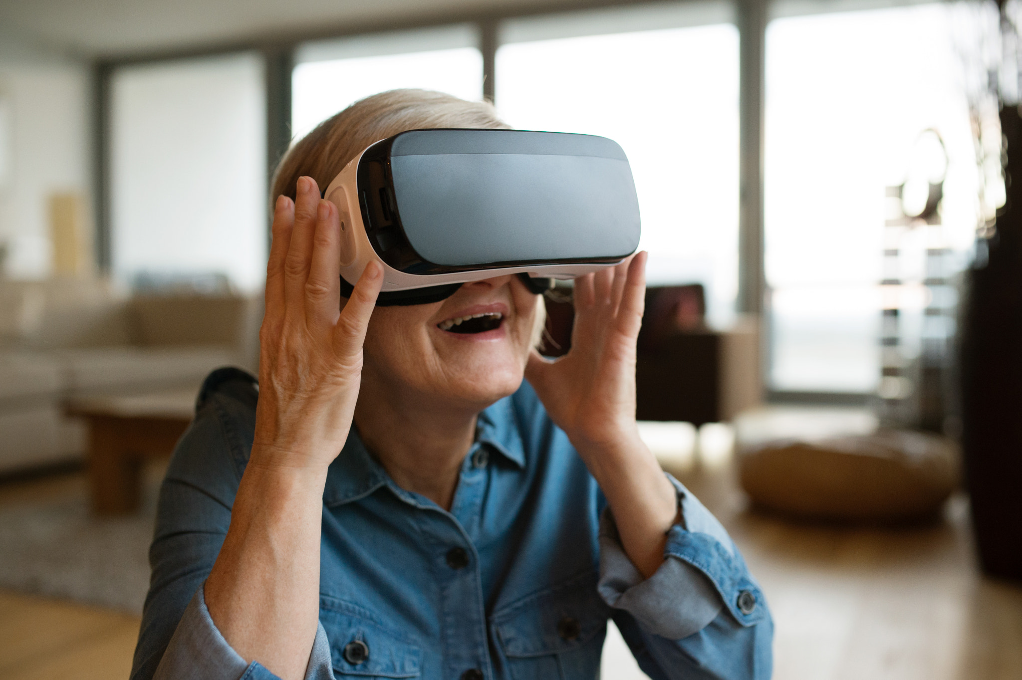 Nikon D4S sample photo. Senior woman wearing virtual reality goggles at home photography