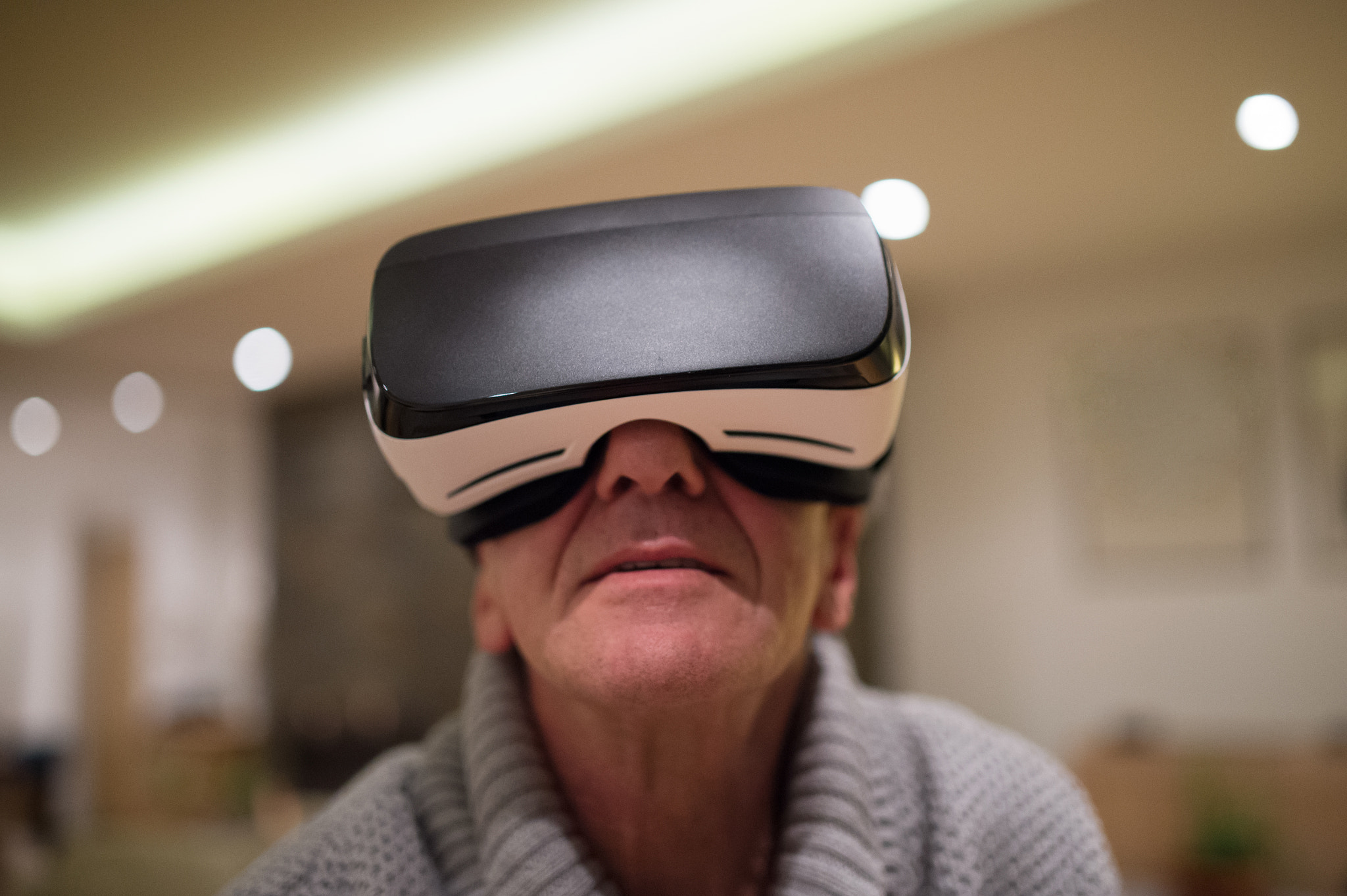 Nikon D4S sample photo. Senior man wearing virtual reality goggles at home photography