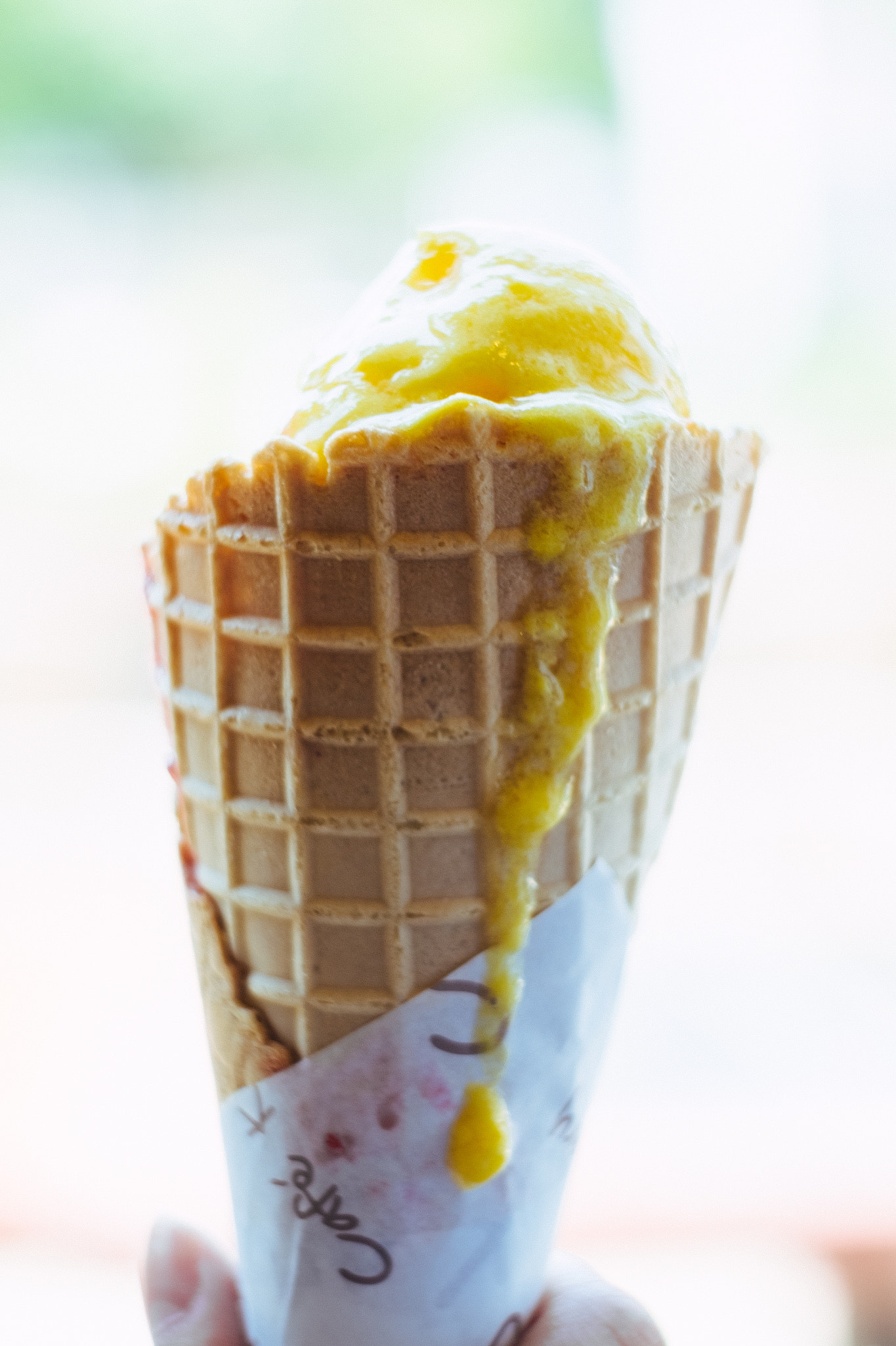 Fujifilm X-T10 sample photo. Gelato ice cream cone held up to the hot summer photography