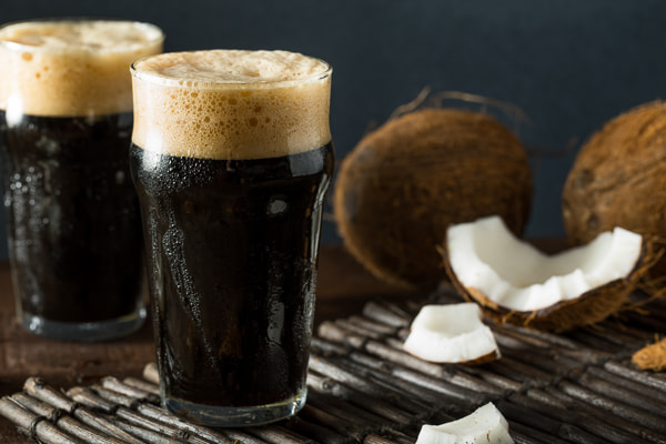 Canon EOS 5D Mark IV sample photo. Refreshing cold dark coconut beer photography