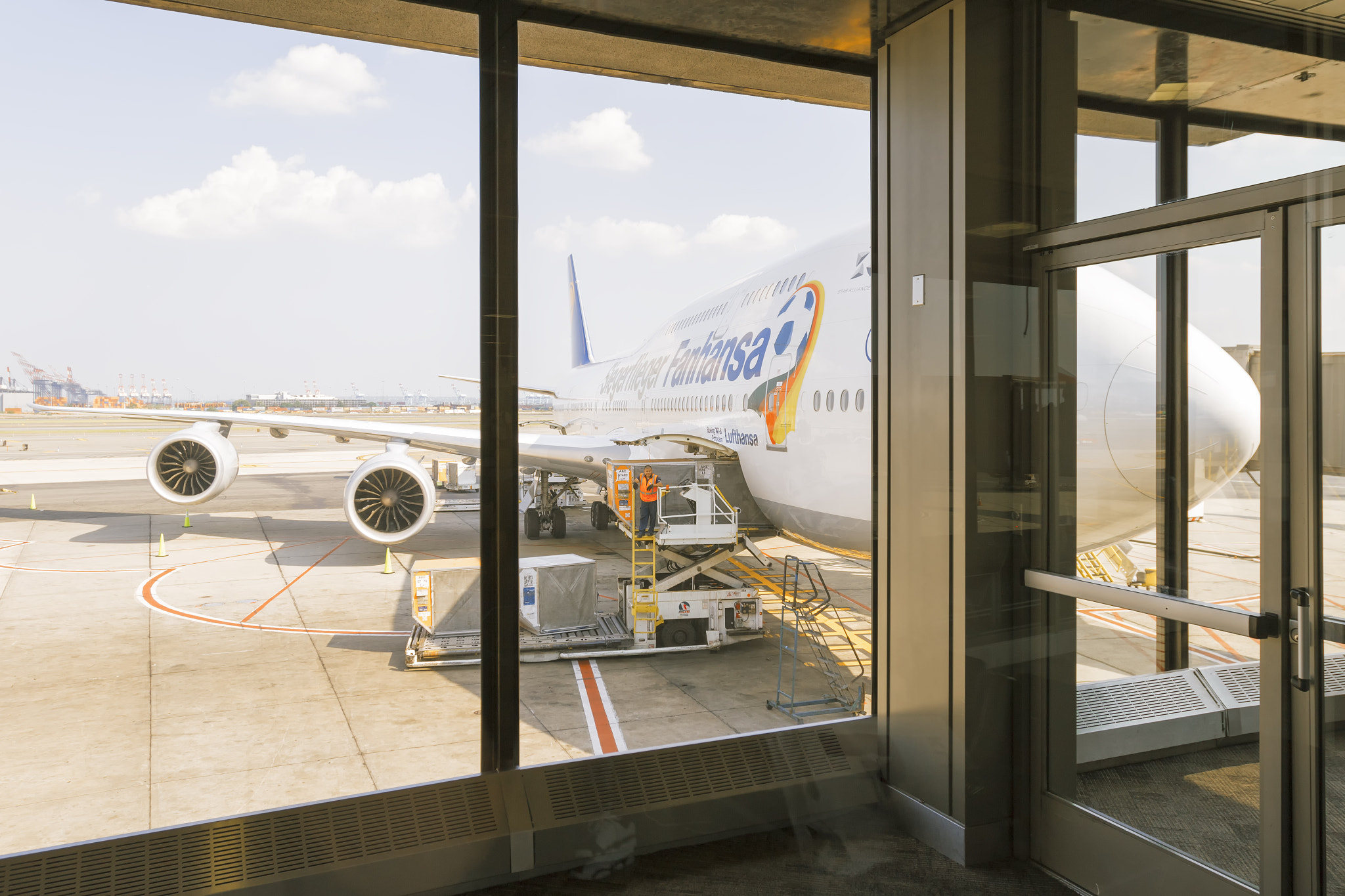 Canon EOS 7D Mark II sample photo. Lufthansa plane at jfk airport terminal photography