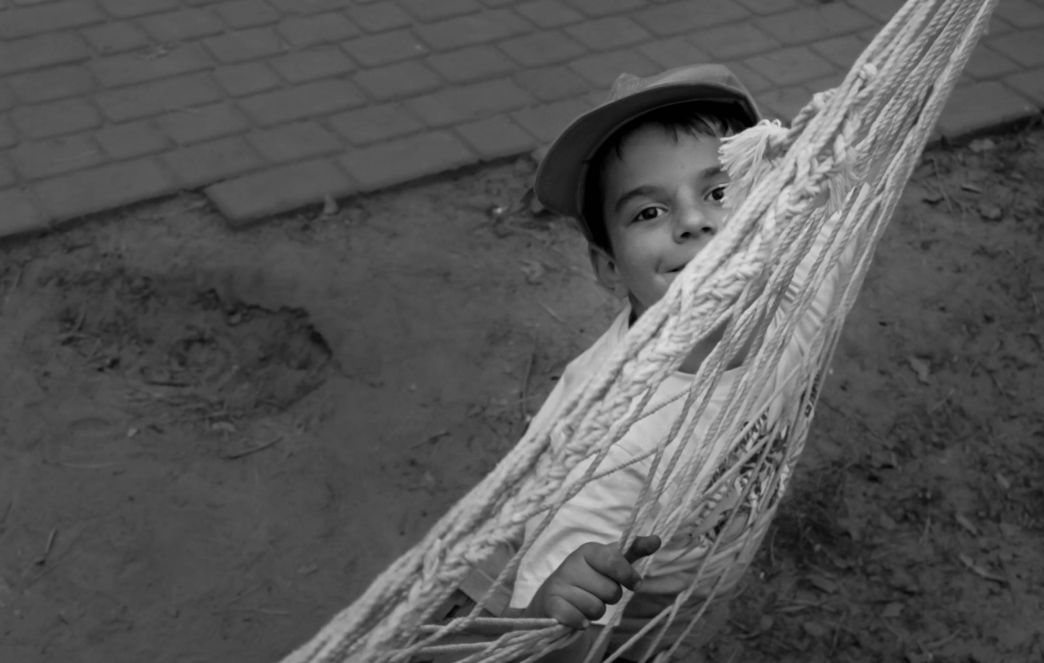 Canon EF-S 17-85mm F4-5.6 IS USM sample photo. Boy in hammock photography
