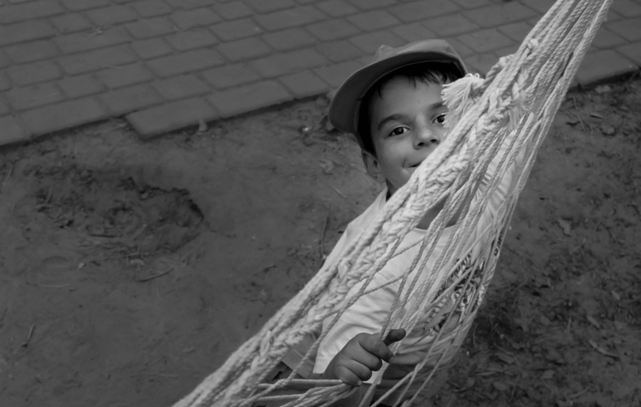 Canon EOS 50D + Canon EF-S 17-85mm F4-5.6 IS USM sample photo. Boy in hammock photography