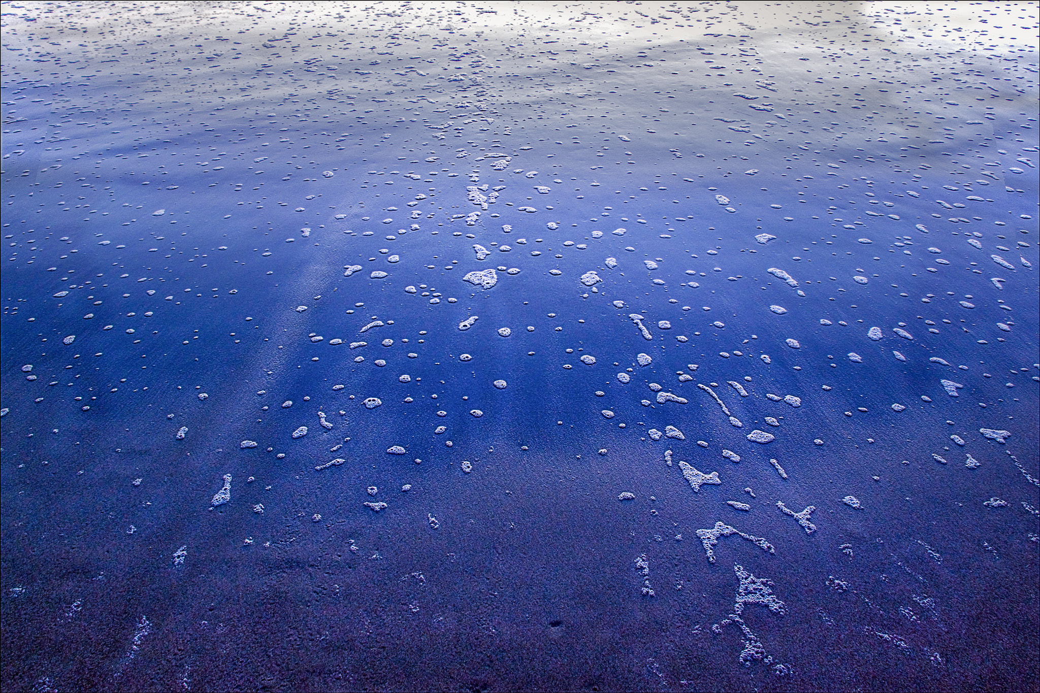Canon EF-S 18-200mm F3.5-5.6 IS sample photo. Reflecting on a beach photography