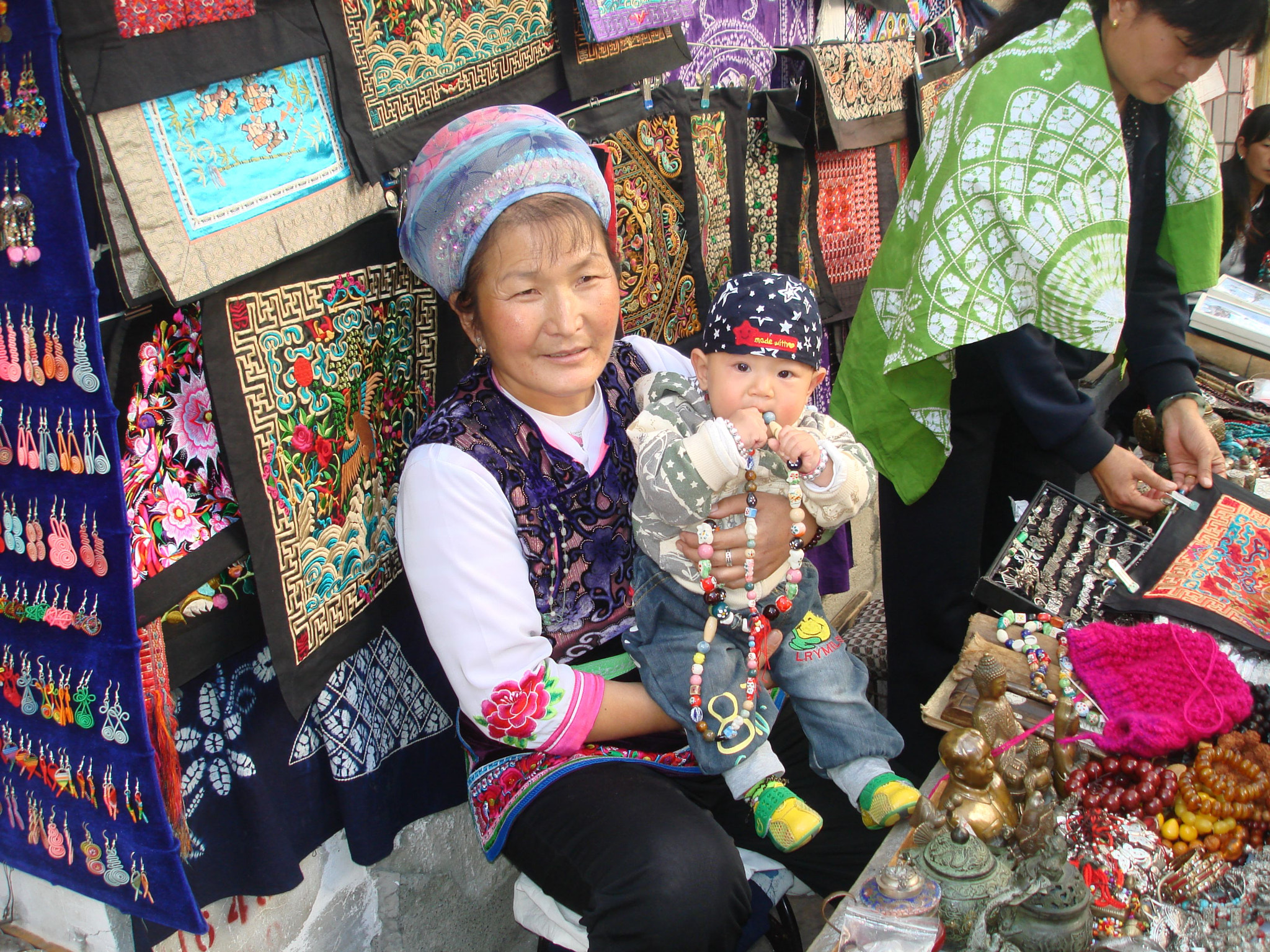 Sony DSC-W100 sample photo. Mother and child, market seller photography