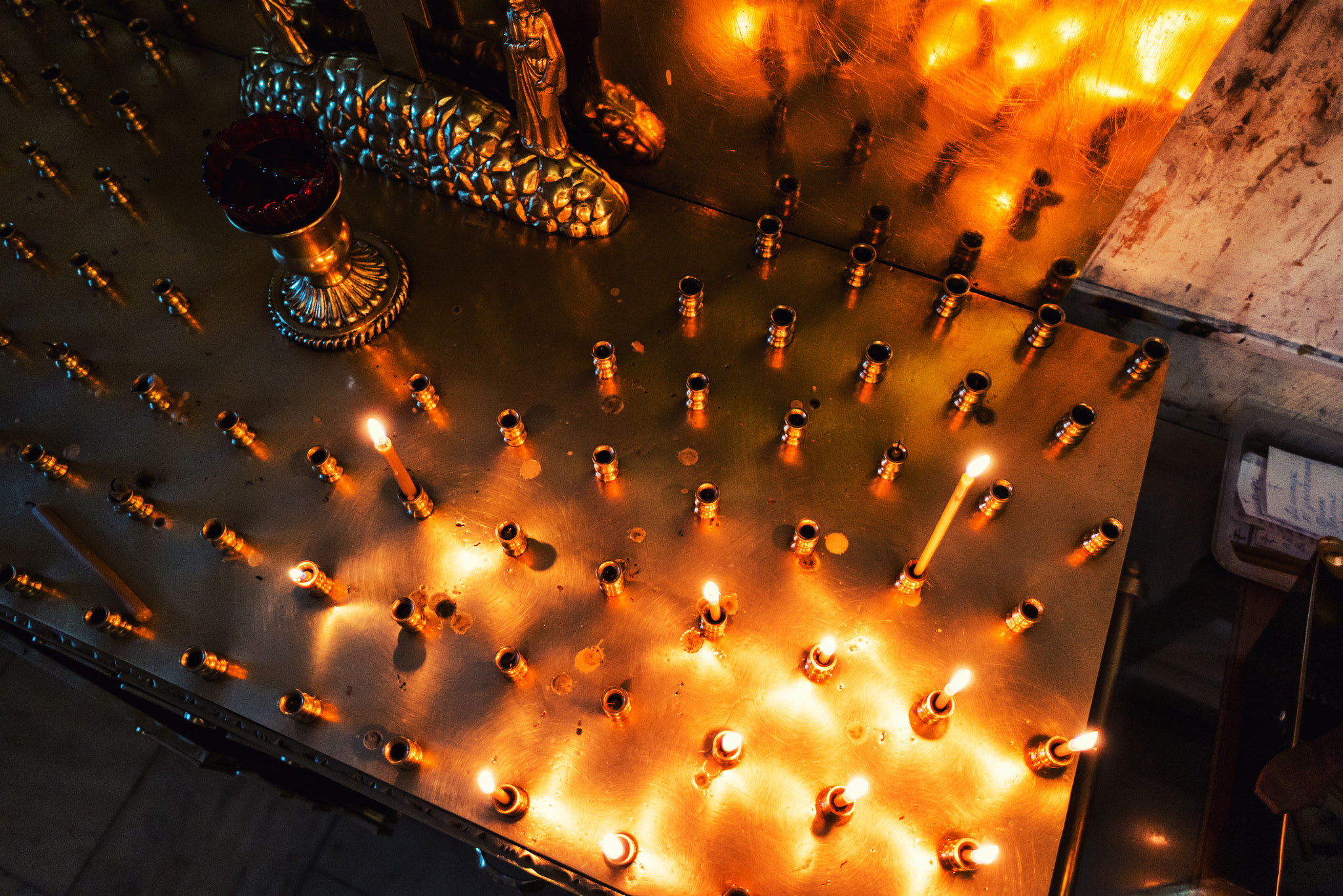 Samsung NX 16mm F2.4 Pancake sample photo. Candle altar of holy trinity monastery photography