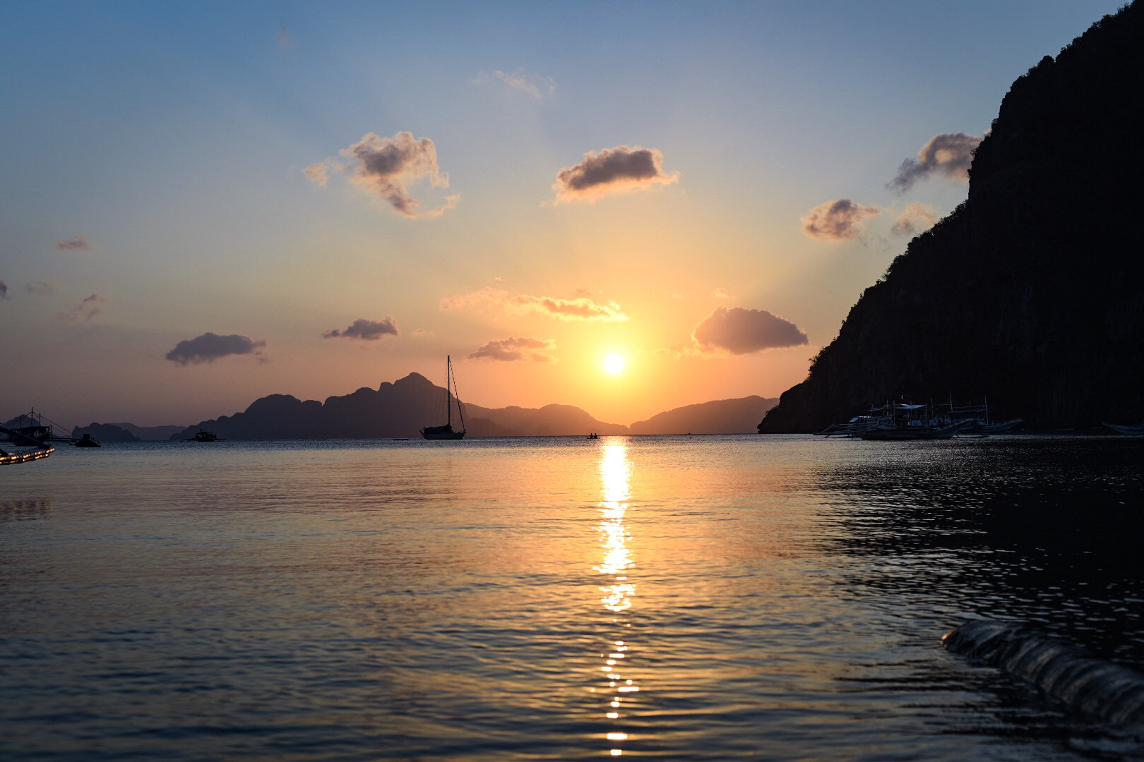 Nikon D750 sample photo. The sun setting behind the islands outside of el nido, palawan, philippines photography