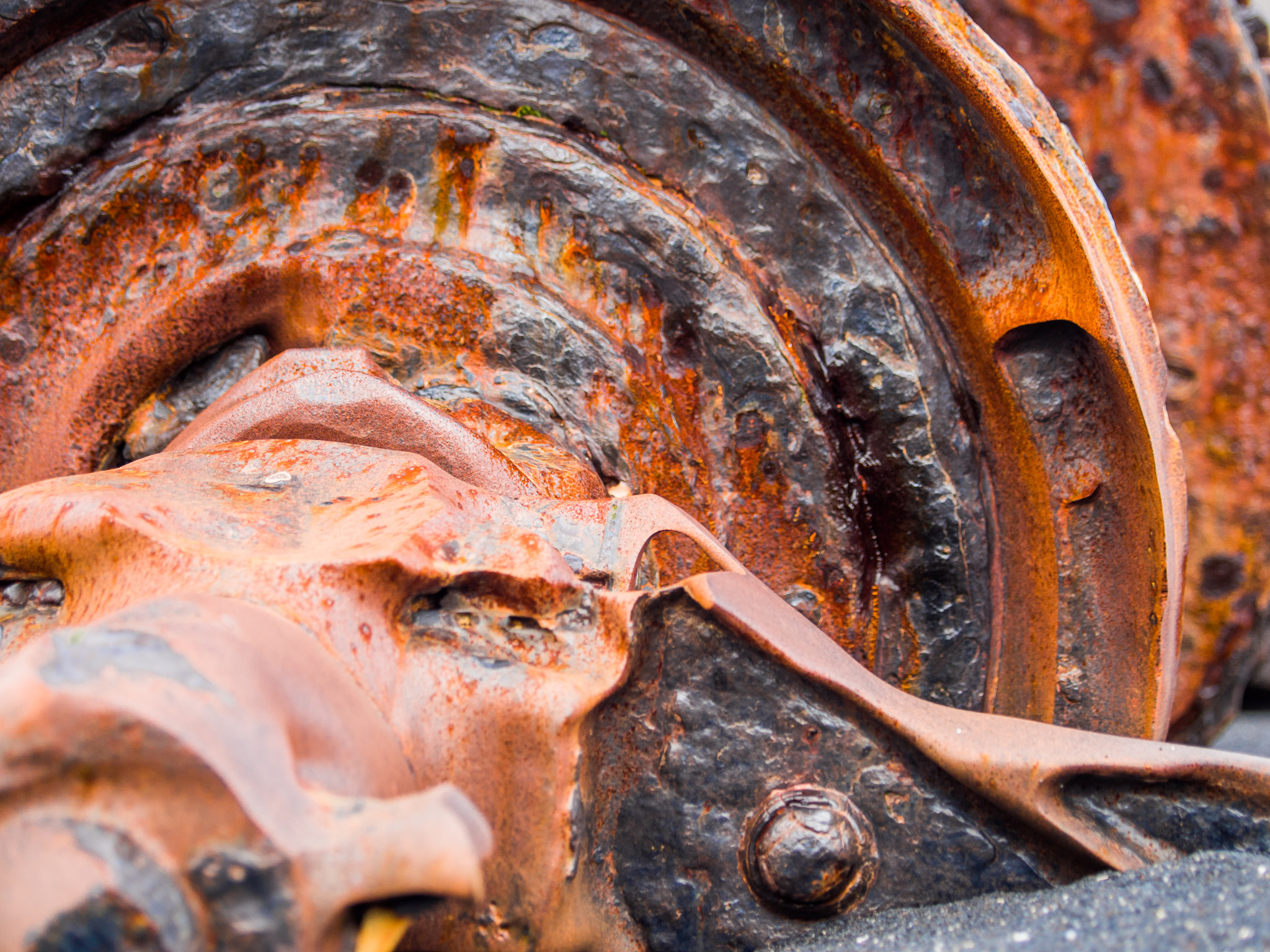 Olympus OM-D E-M5 sample photo. Rusting machinery on a beach photography