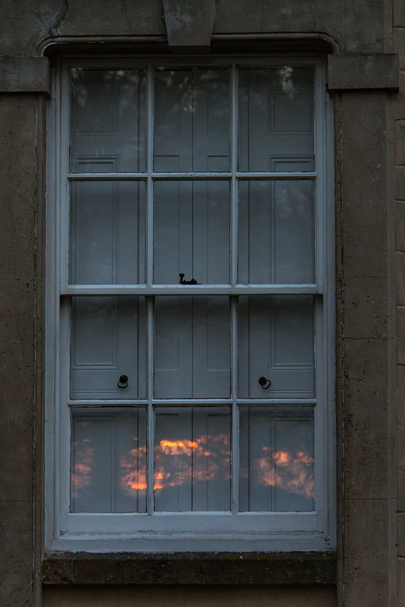 Canon EF-S 18-200mm F3.5-5.6 IS sample photo. Sunset reflected in window photography