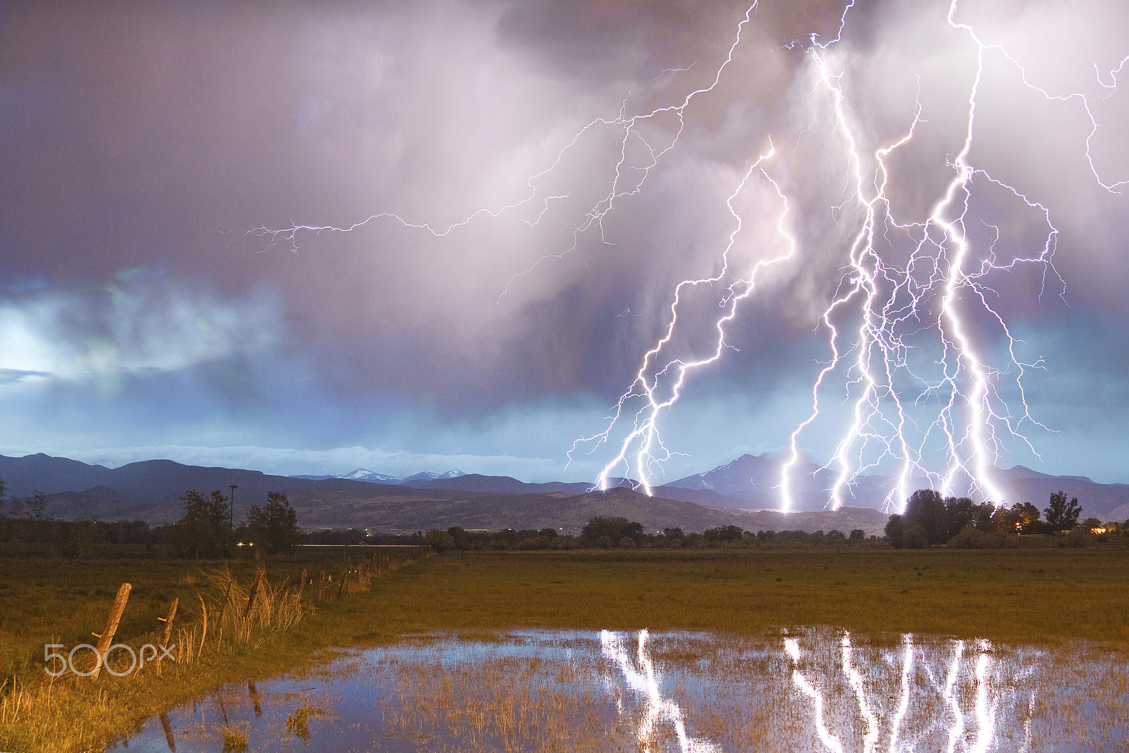 Canon EOS 7D + Canon EF 28-135mm F3.5-5.6 IS USM sample photo. Lightning striking longs peak foothills 4 photography