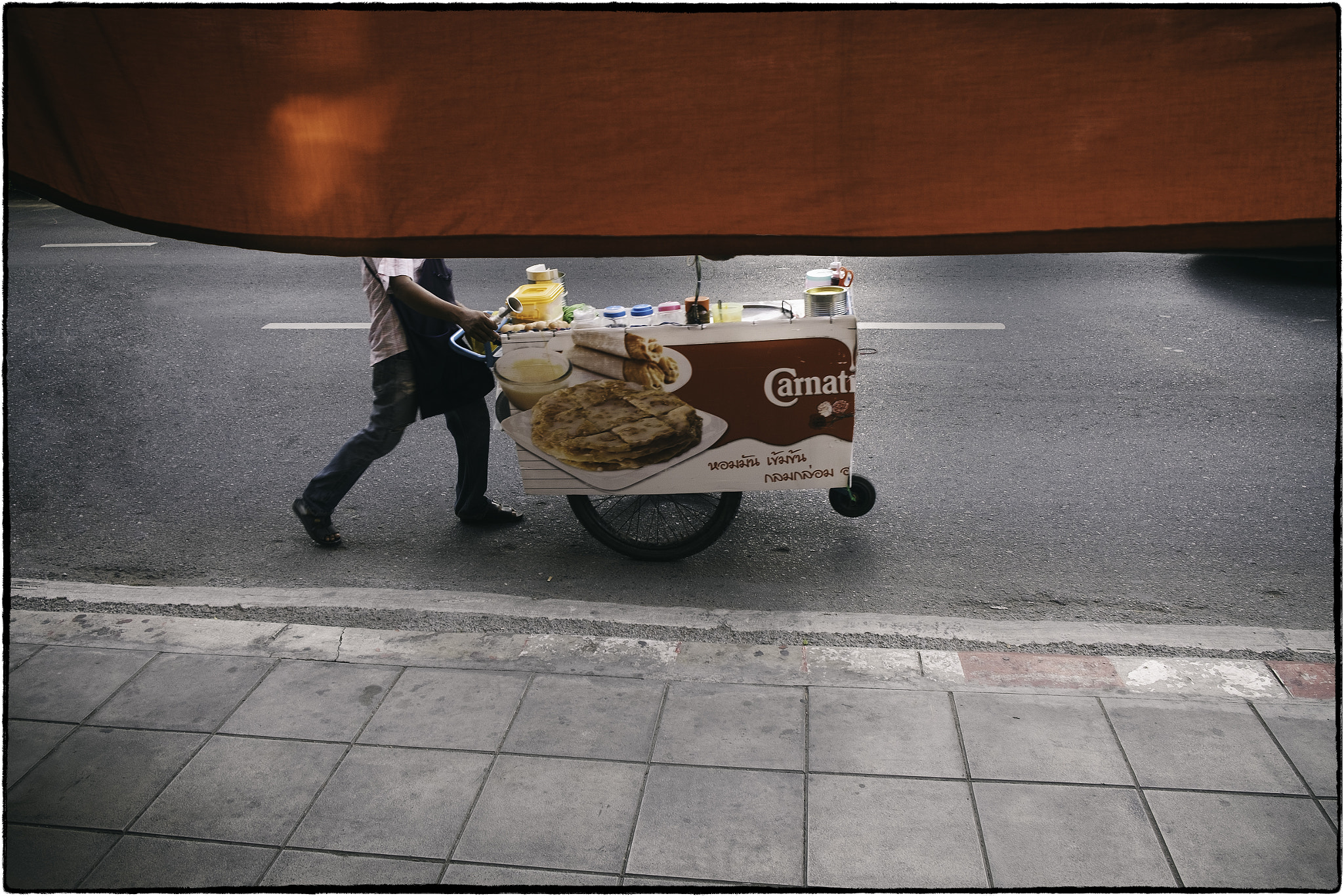 Fujifilm X-T1 sample photo. Bangkok street cart vendor and red sun shade. photography