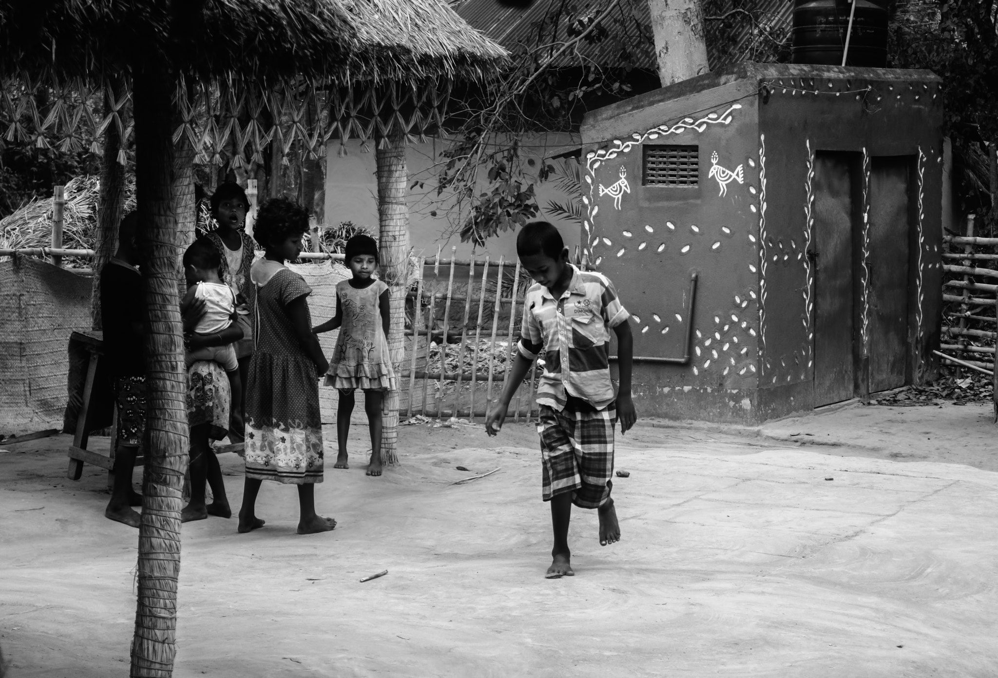 Nikon D7200 sample photo. Vilage boys and girls playing traditional games in the early morning with copy space photography