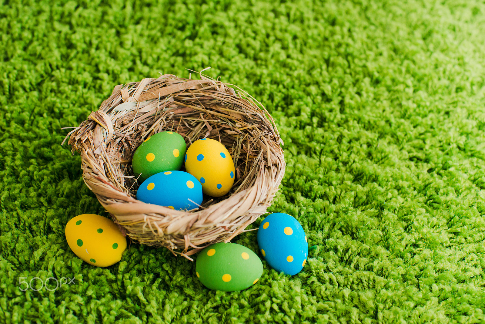 Nikon D800 + Nikon AF Nikkor 50mm F1.4D sample photo. Easter eggs in a nest on a green background photography