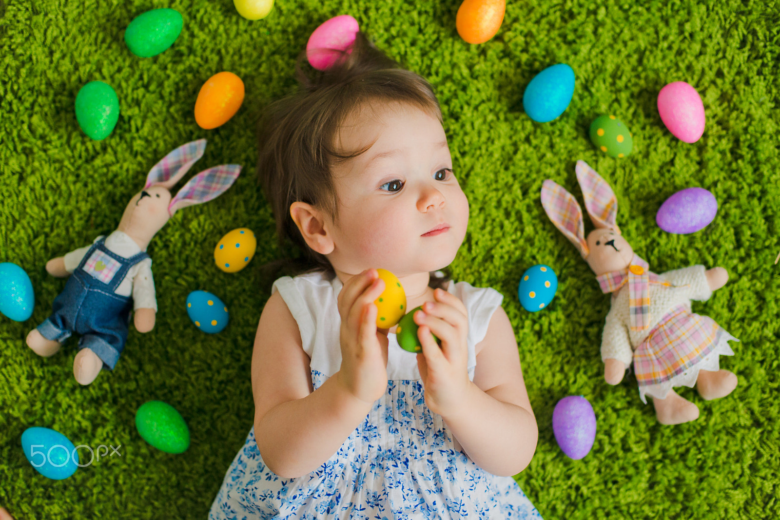 Nikon D800 + Nikon AF Nikkor 50mm F1.4D sample photo. Child lies on the grass with easter eggs and a hare photography