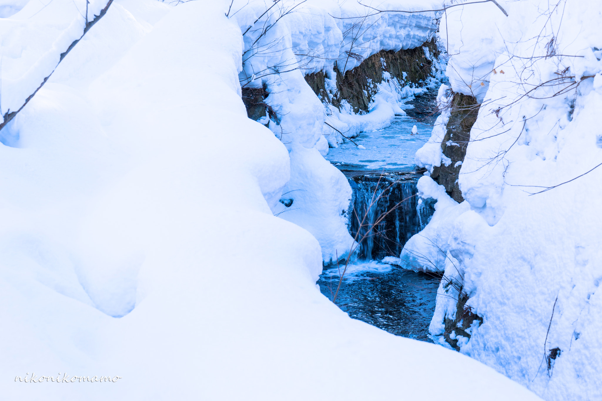 Sony a7 sample photo. A river flowing in the snow. photography