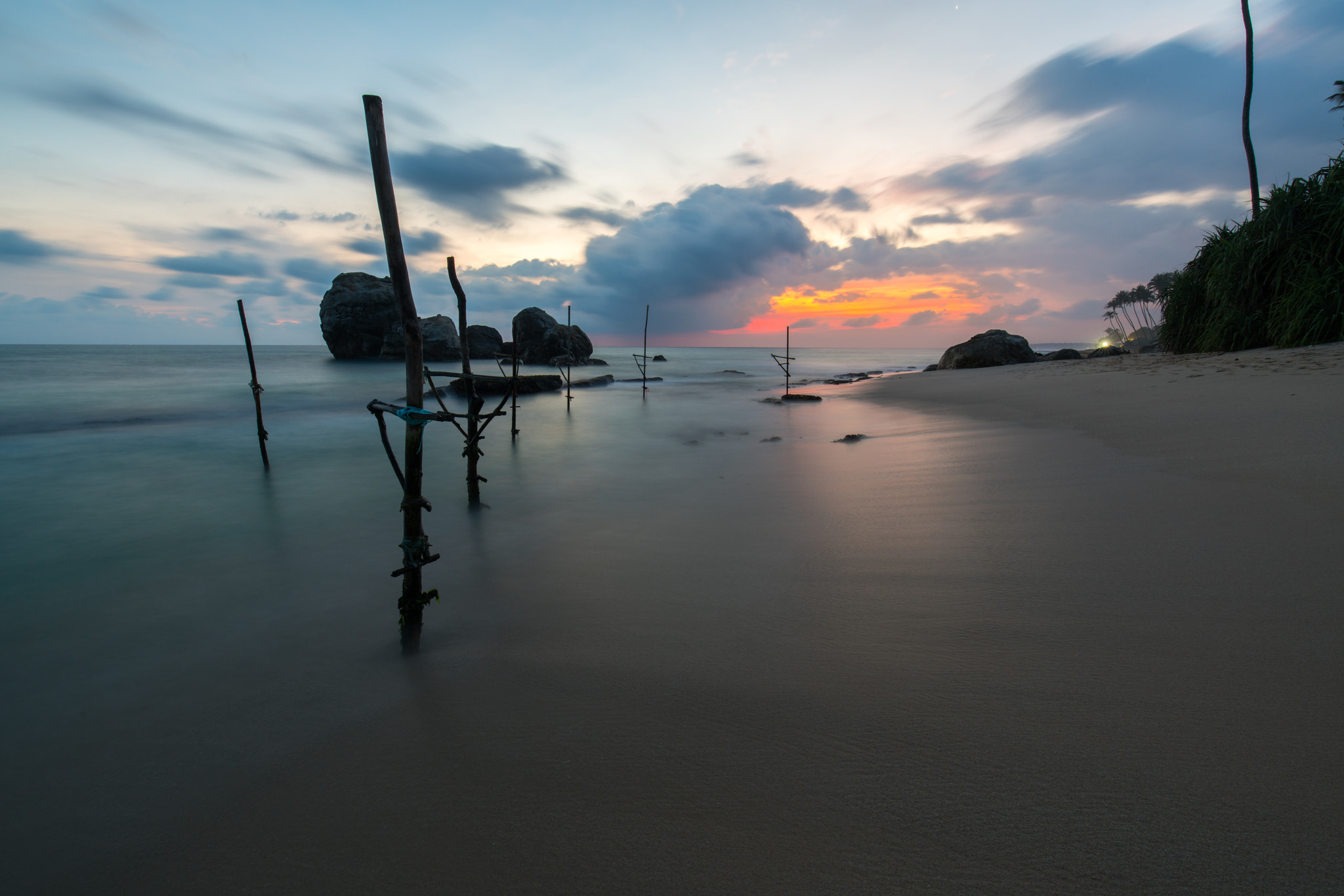 Canon EF 16-35mm F4L IS USM sample photo. Stilts in the sea photography