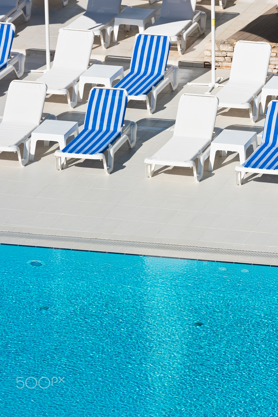 Nikon D810 sample photo. Hotel poolside chairs near a swimming pool photography