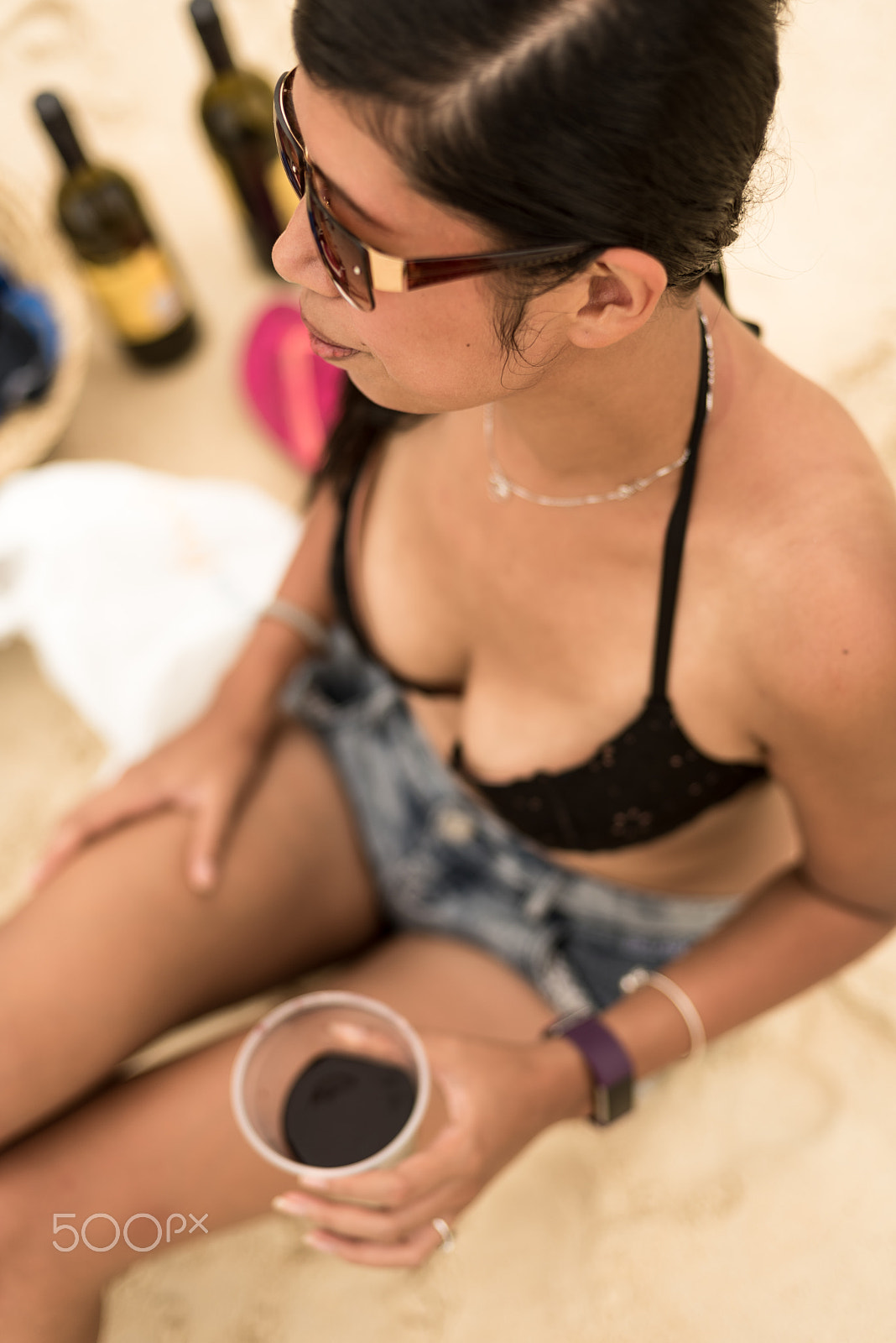 Nikon D750 sample photo. A pretty woman sitting by the beach photography