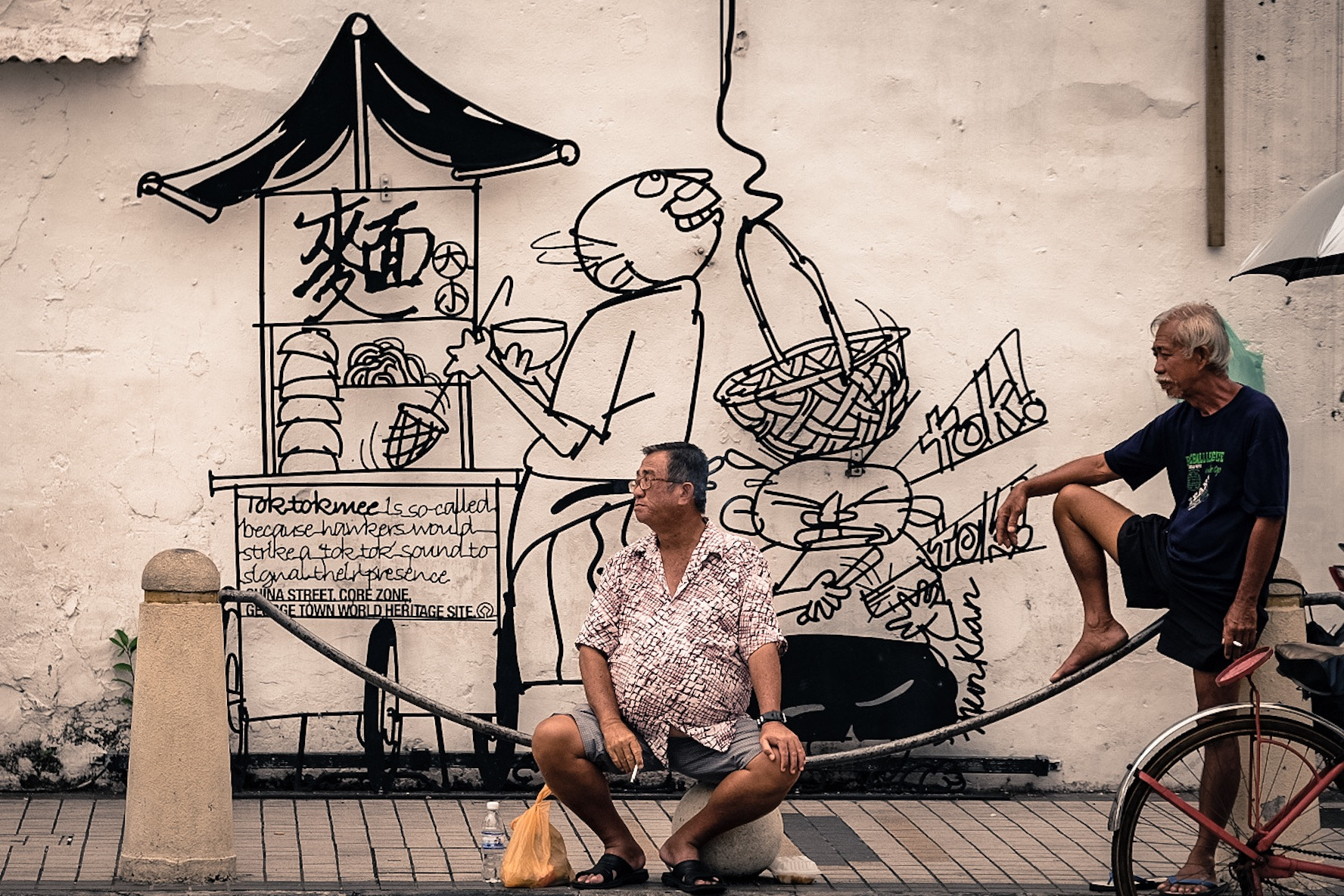 Fujifilm X-T10 sample photo. Two men and an artwork photography