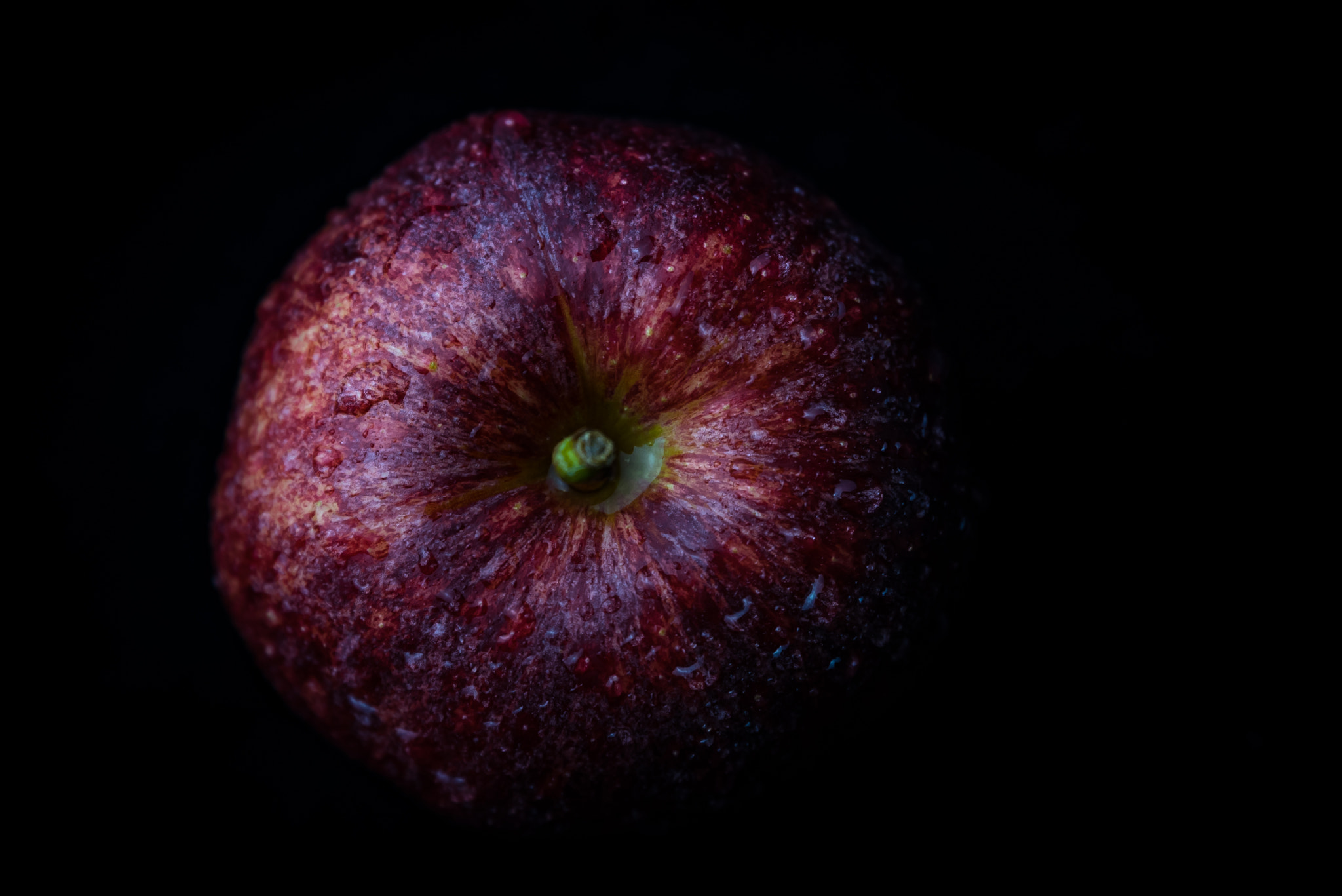 Nikon D750 sample photo. Red apple against black background photography