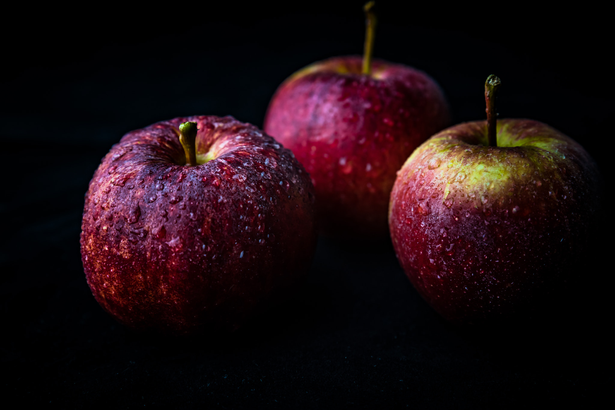 Nikon D750 sample photo. Red apple against black background photography