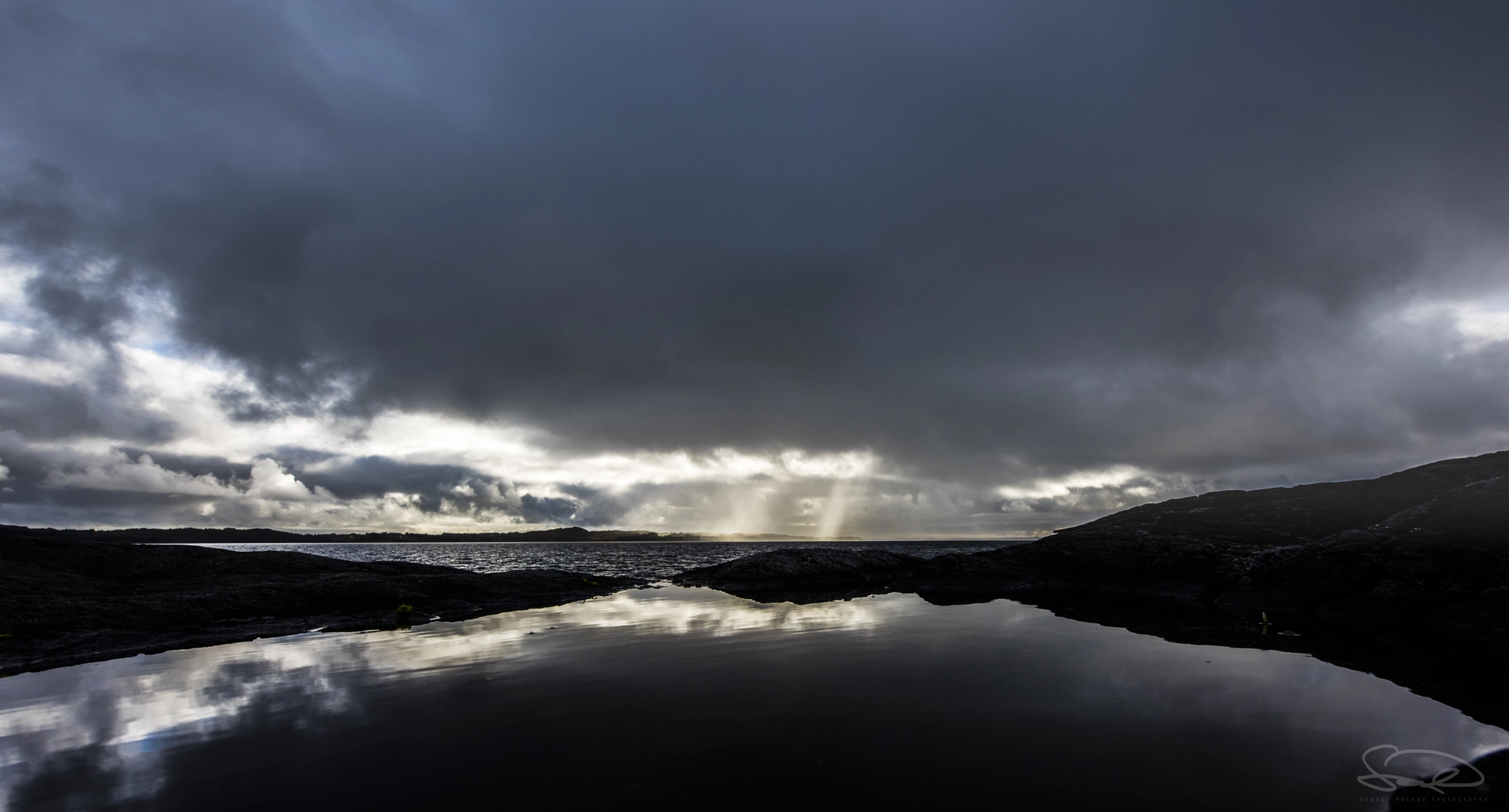 Nikon D810 sample photo. Rays of light through heavy rain skies photography