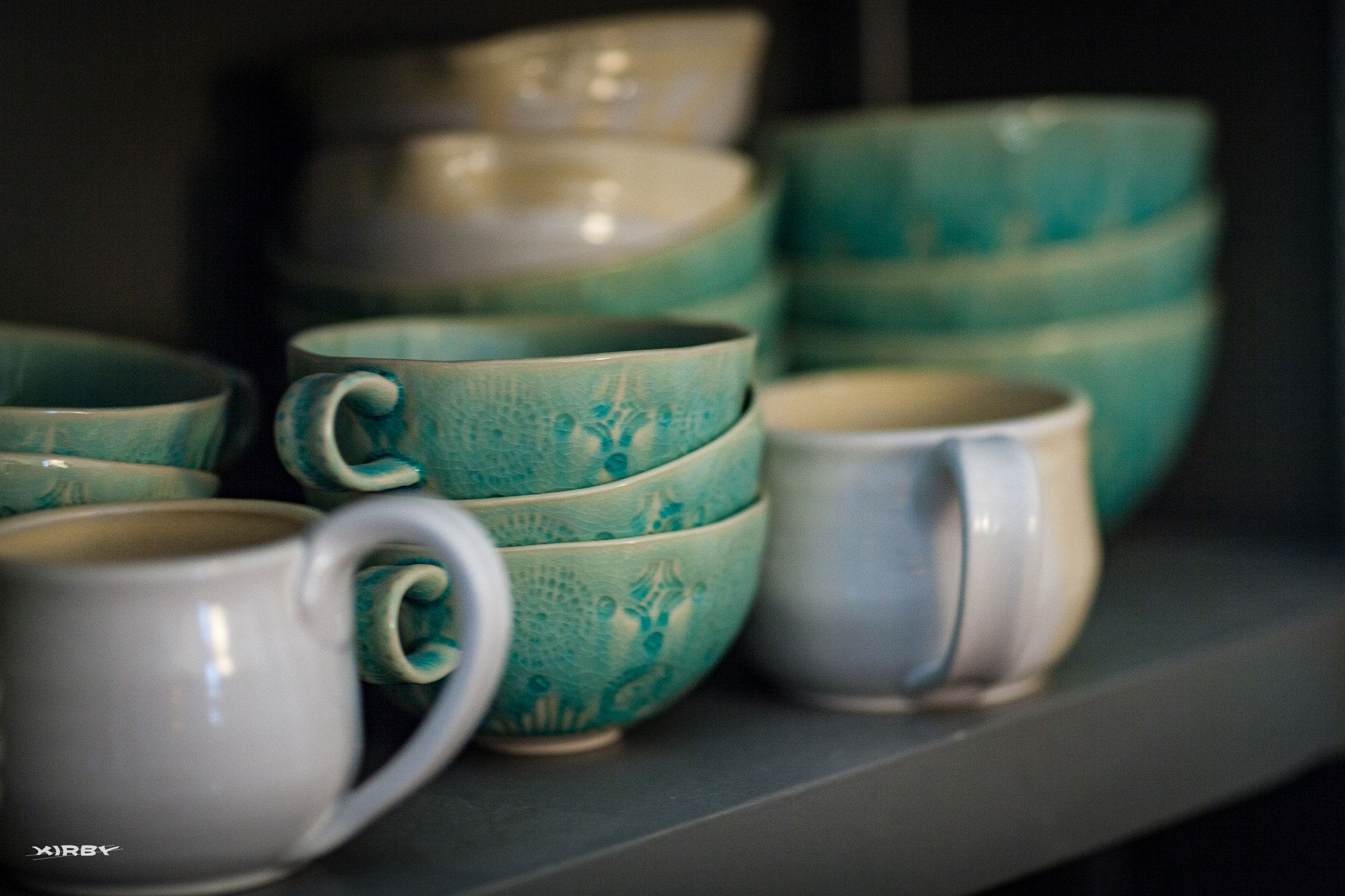 Canon EF 135mm F2L USM sample photo. Ceramic cups on a shelf photography