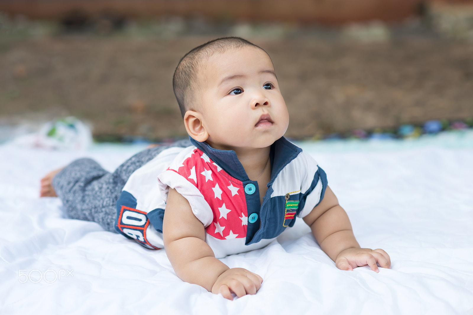 Nikon D600 + Nikon AF-S Nikkor 85mm F1.8G sample photo. Adorable little boy lying on white bed photography