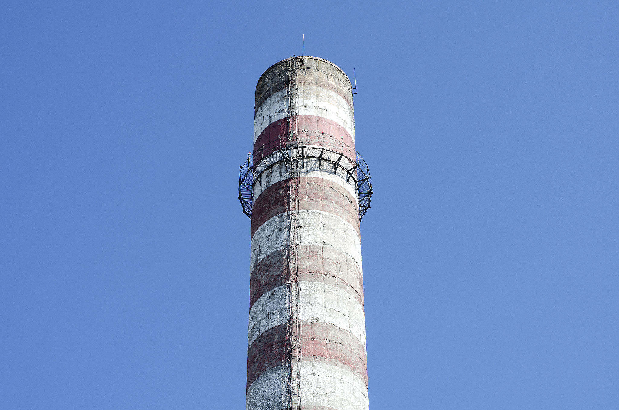 Nikon D5100 + Nikon AF-S Nikkor 50mm F1.8G sample photo. Industrial chimney against blue sky photography
