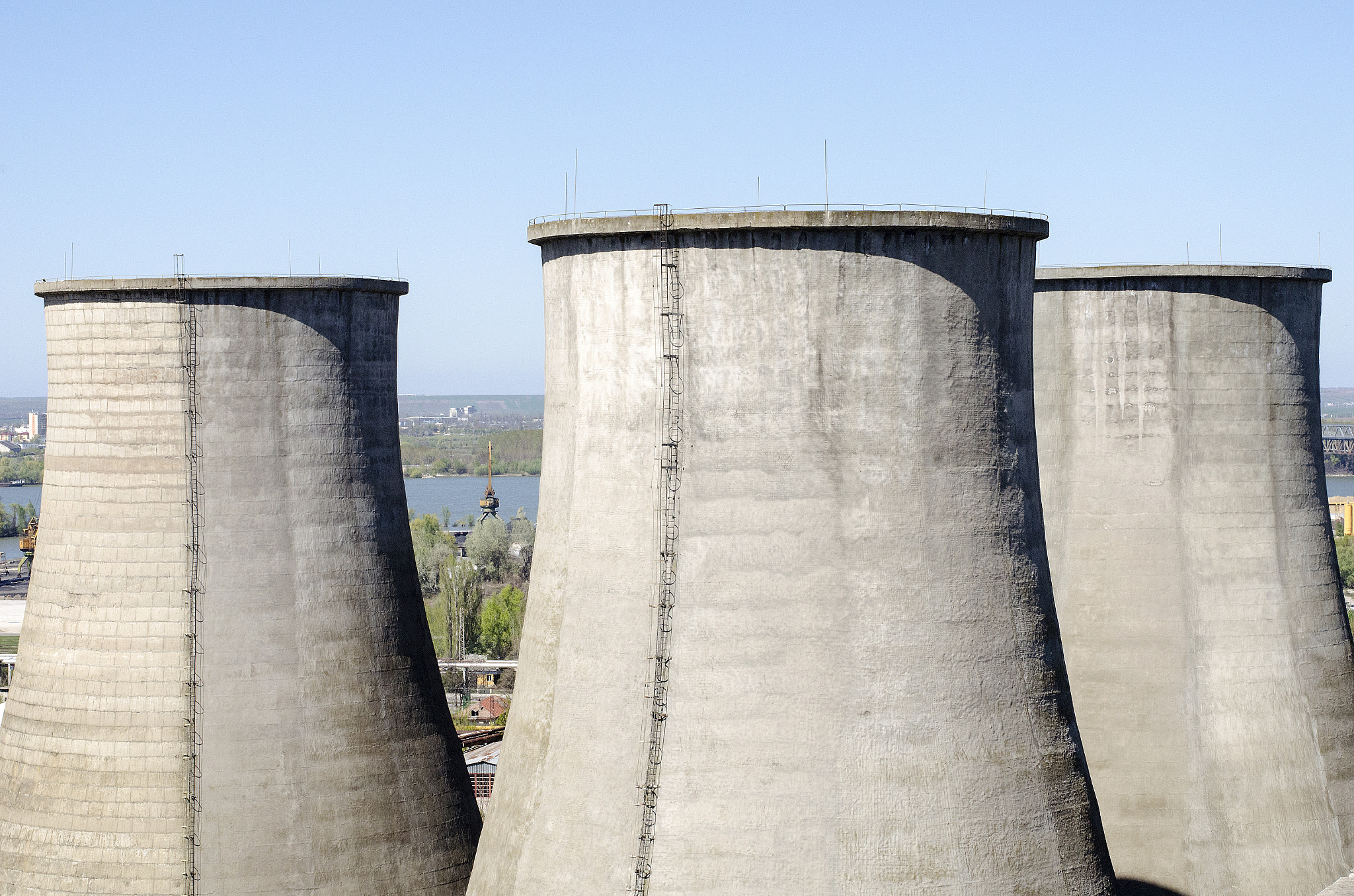 Nikon D5100 + Nikon AF-S Nikkor 50mm F1.8G sample photo. Industrial chimney against blue sky photography