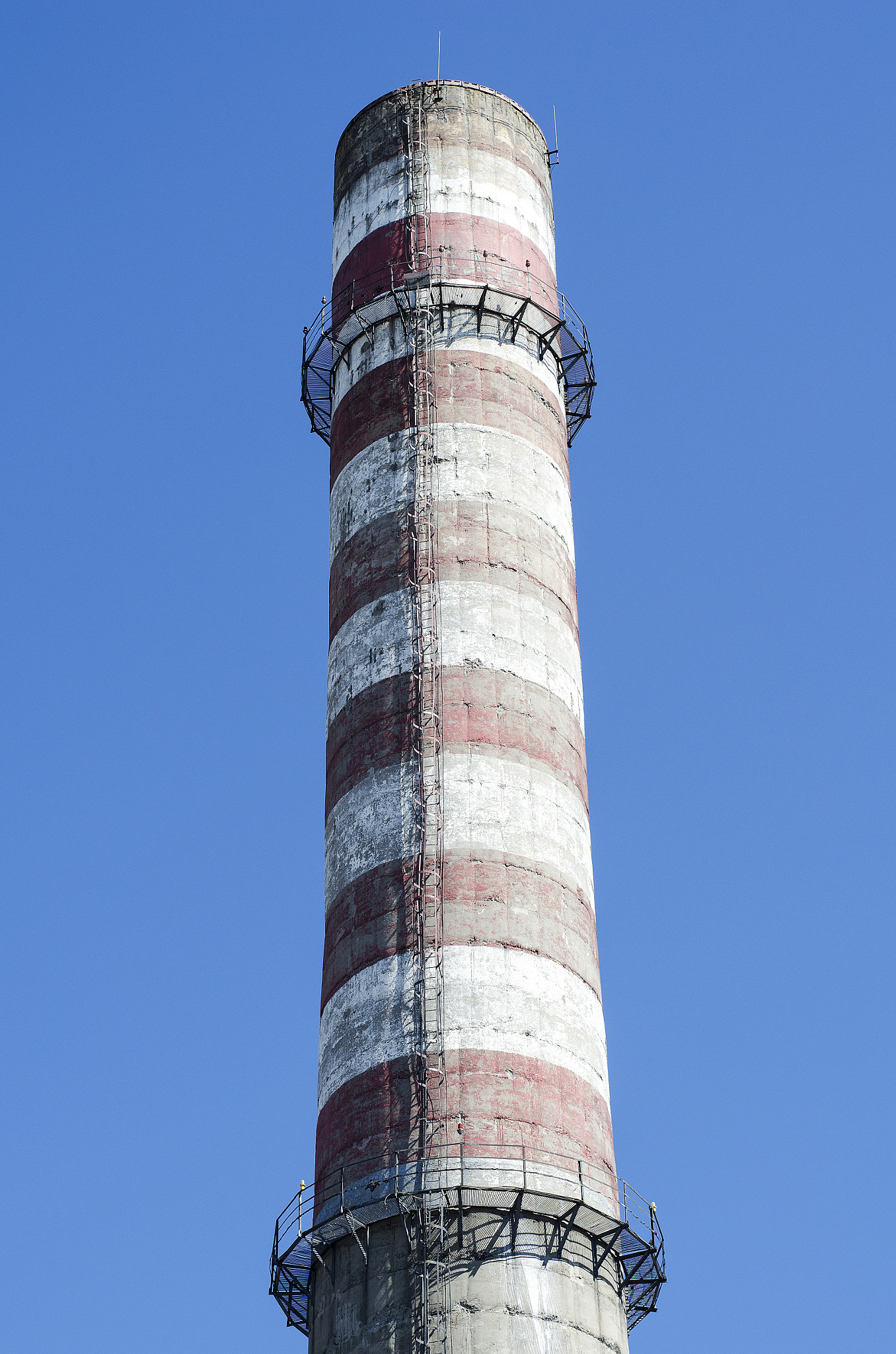 Nikon D5100 + Nikon AF-S Nikkor 50mm F1.8G sample photo. Industrial chimney against blue sky photography