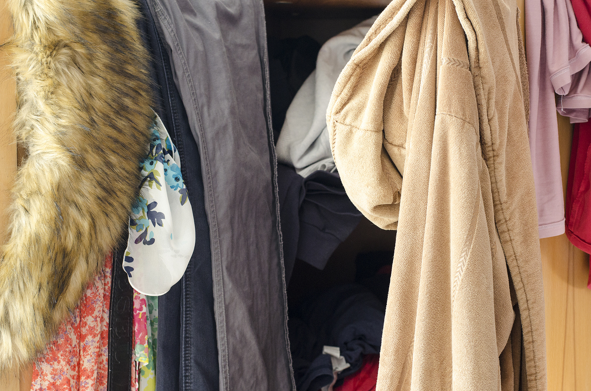 Nikon D5100 + Nikon AF-S Nikkor 50mm F1.8G sample photo. Pile of carelessly scattered clothes in wardrobe photography