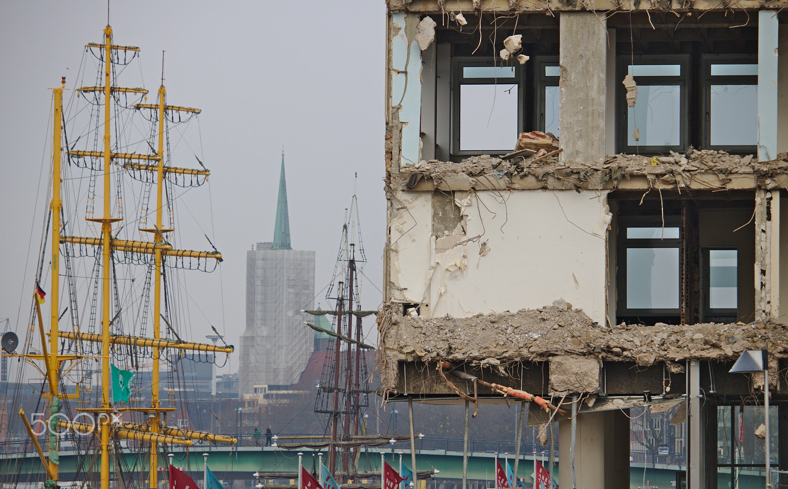 Canon EOS 750D (EOS Rebel T6i / EOS Kiss X8i) sample photo. Demolished office building with sailship in the background photography