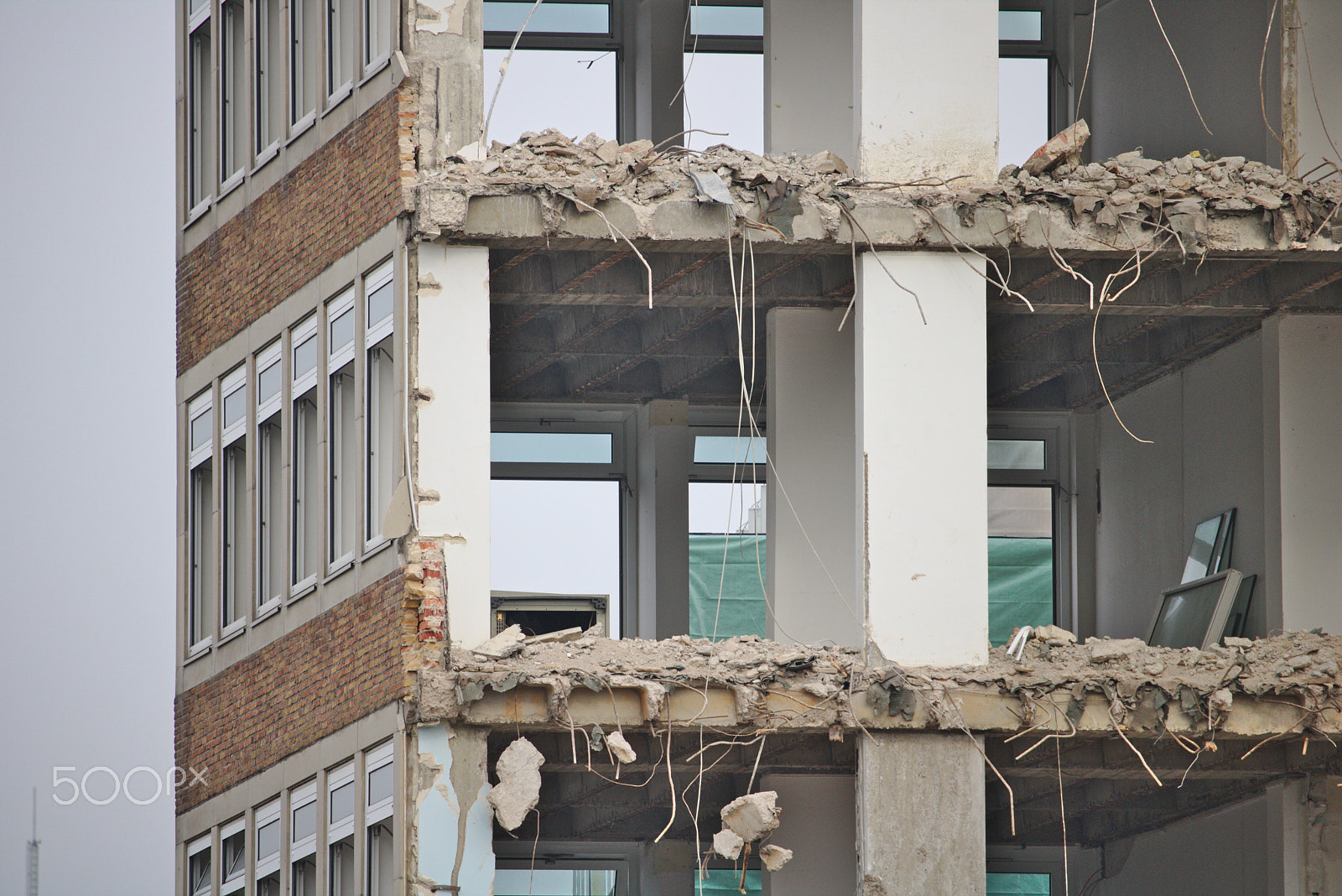 Canon EF-S 55-250mm F4-5.6 IS STM sample photo. Demolished office building with missing walls photography