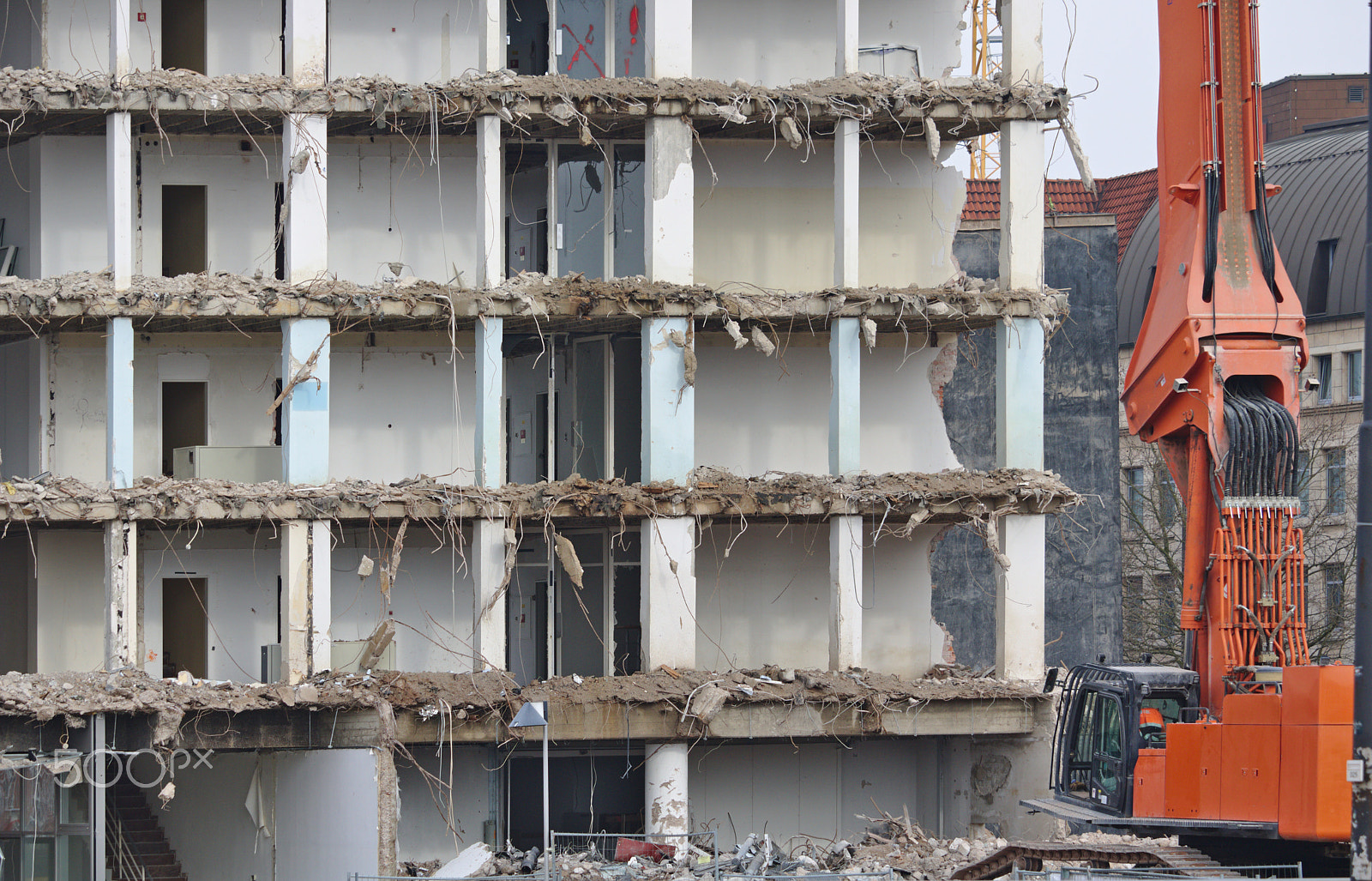 Canon EF-S 55-250mm F4-5.6 IS STM sample photo. Demolished office building with crane photography