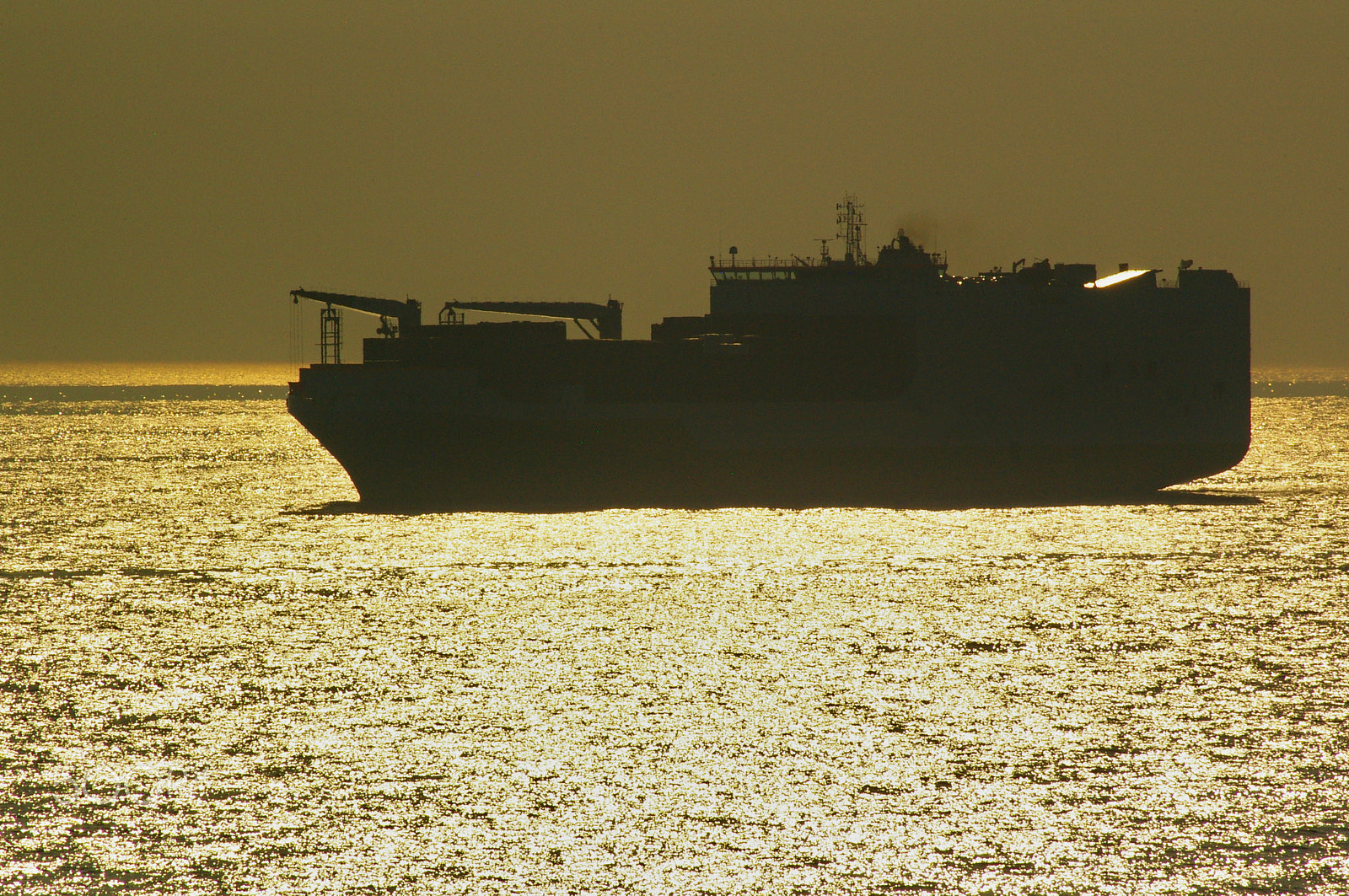 Pentax K100D sample photo. Freighter in the north sea at sunset photography
