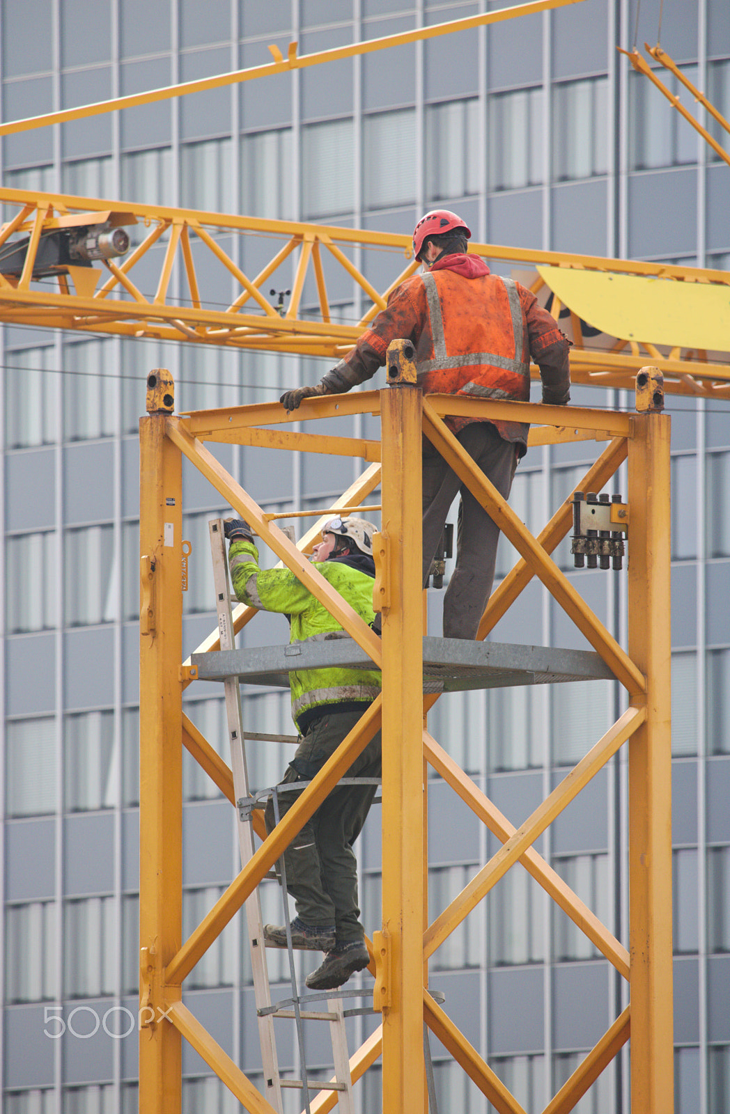 Canon EF-S 55-250mm F4-5.6 IS STM sample photo. Construction workers at the top of a crane photography