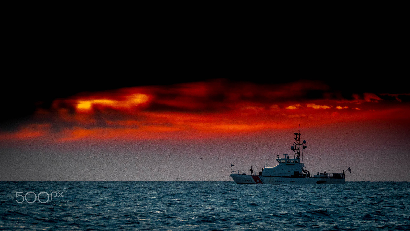 Olympus OM-D E-M1 Mark II sample photo. Us coast guard at sunset photography